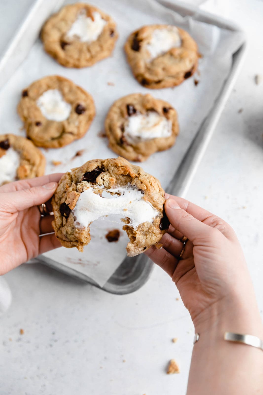 s'mores cooke with a giant marshmallow center being pulled apart