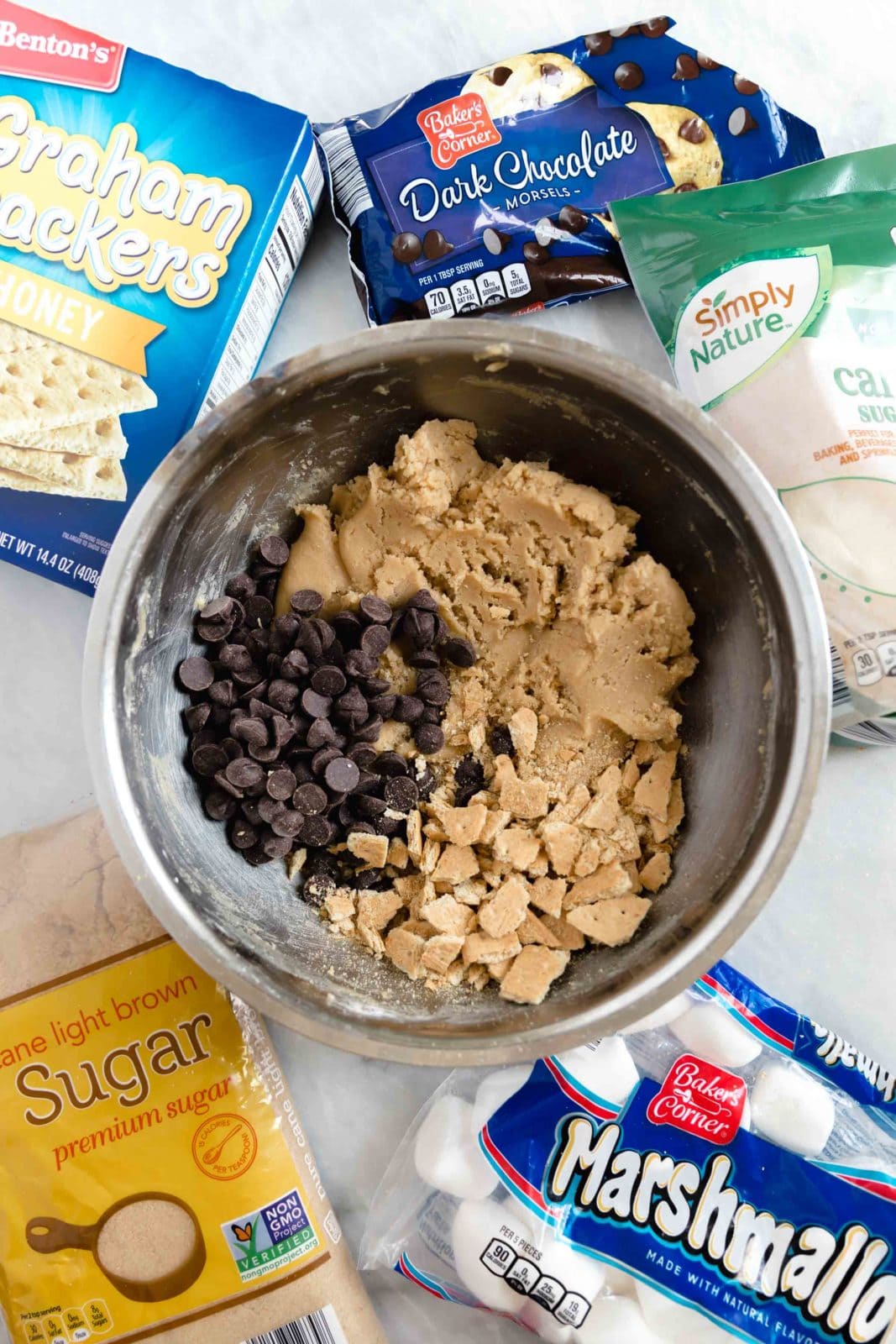 process shot of s'more cookies with cookie dough, graham cracker crumbs, and chocolate chips