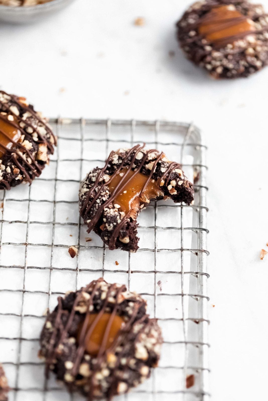 These turtle thumbprint cookies complete with a gooey caramel center and pecan coating. Try not to eat five?