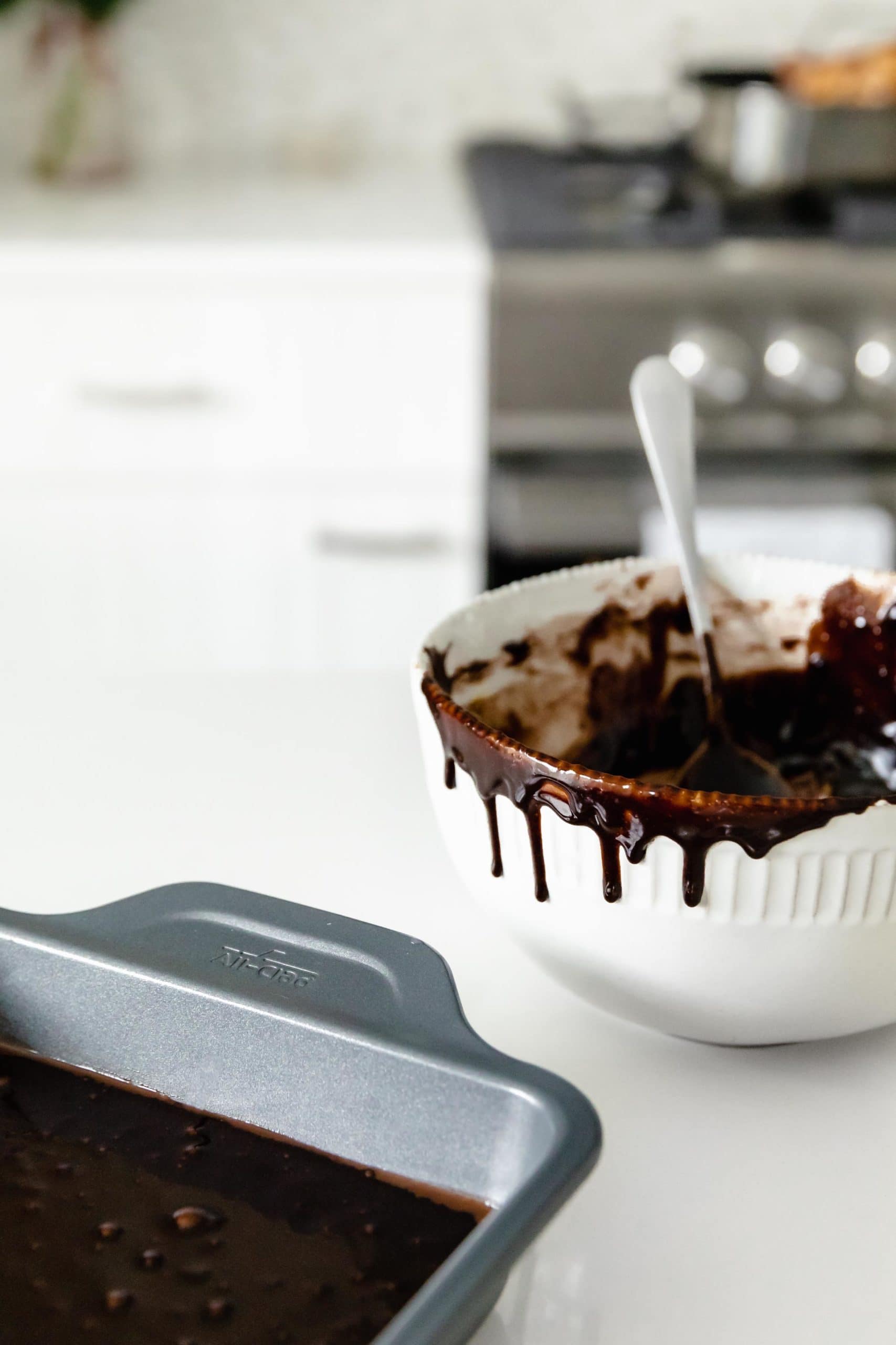 brownie batter dripping in bowl