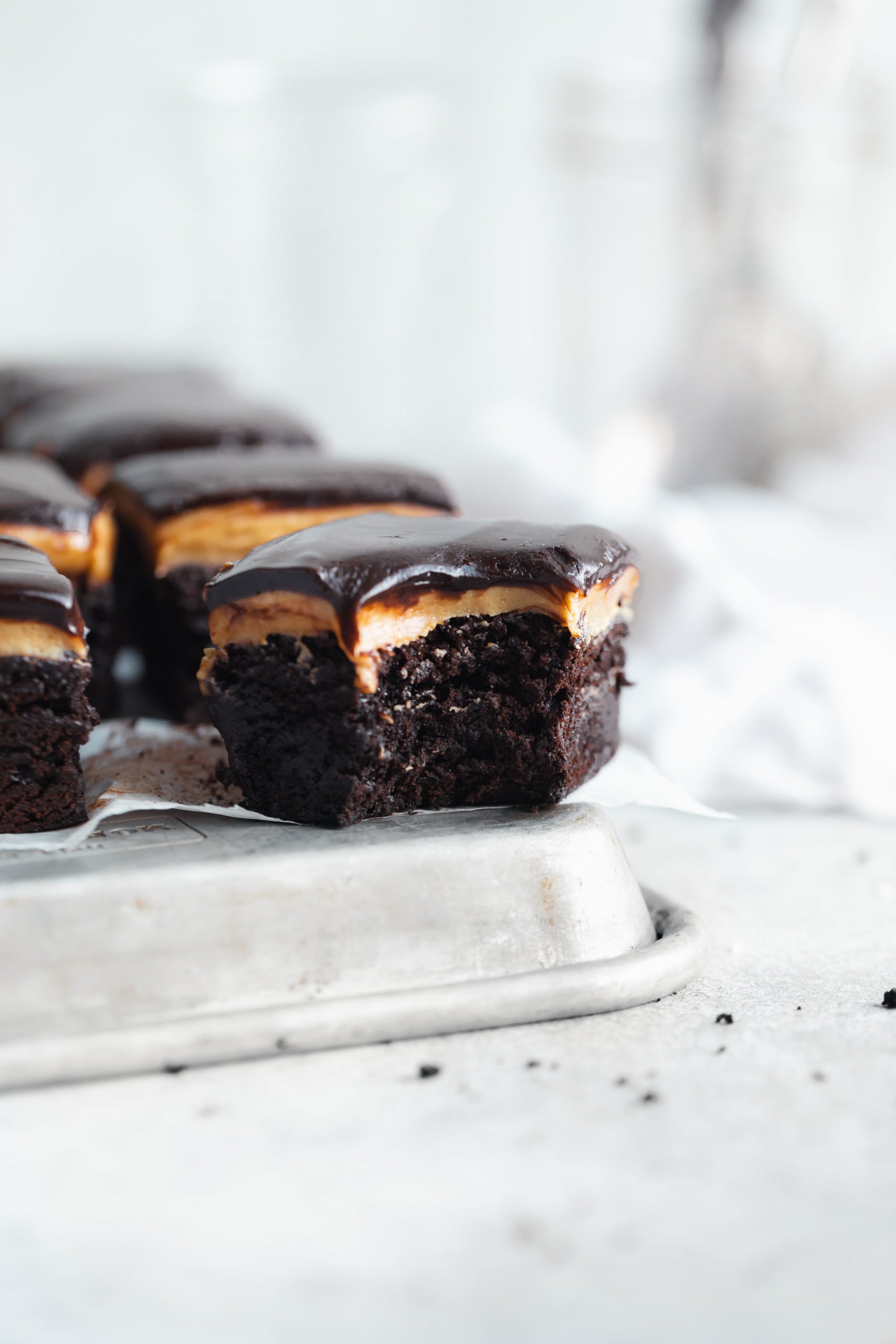 buckeye browies topped with a thick peanut butter topping