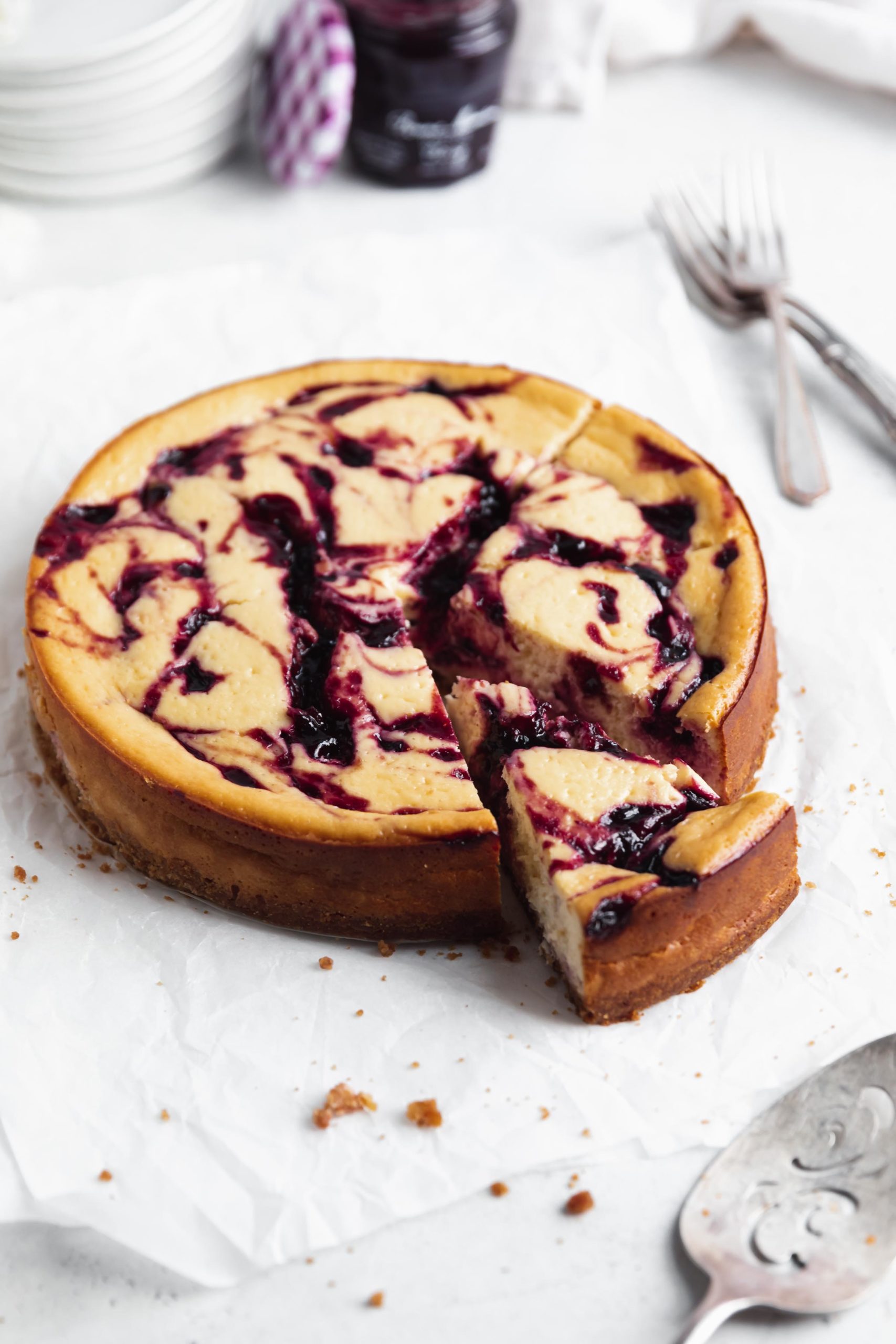 cherry swirled cheesecake with a slice taken out