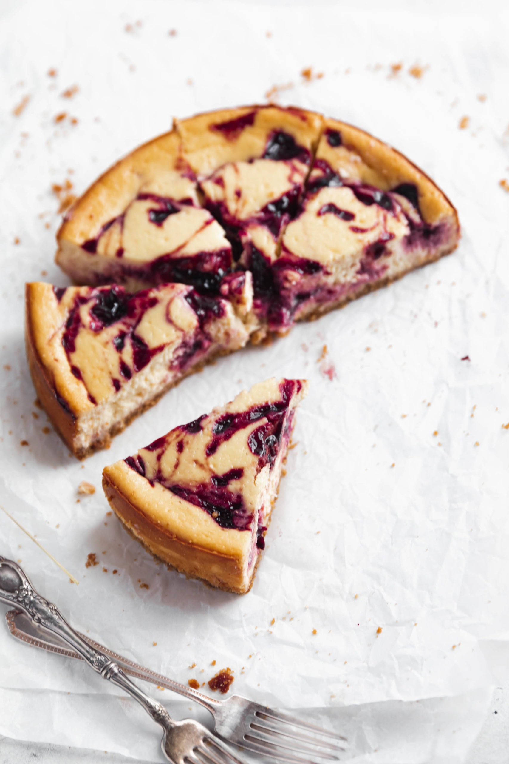 5 pieces of lightened up cherry cheesecake on parchment paper