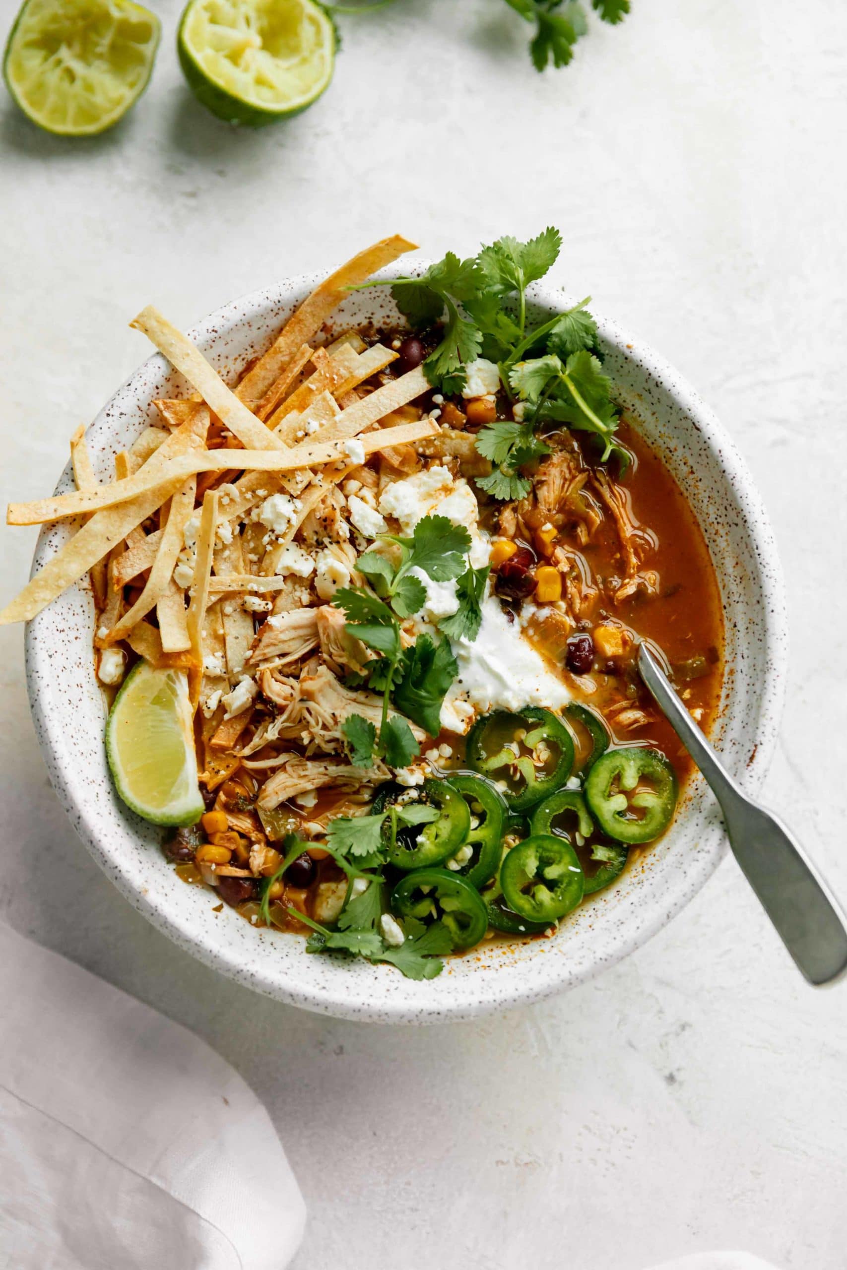 chicken tortilla soup recipe topped with crunchy tortilla strips