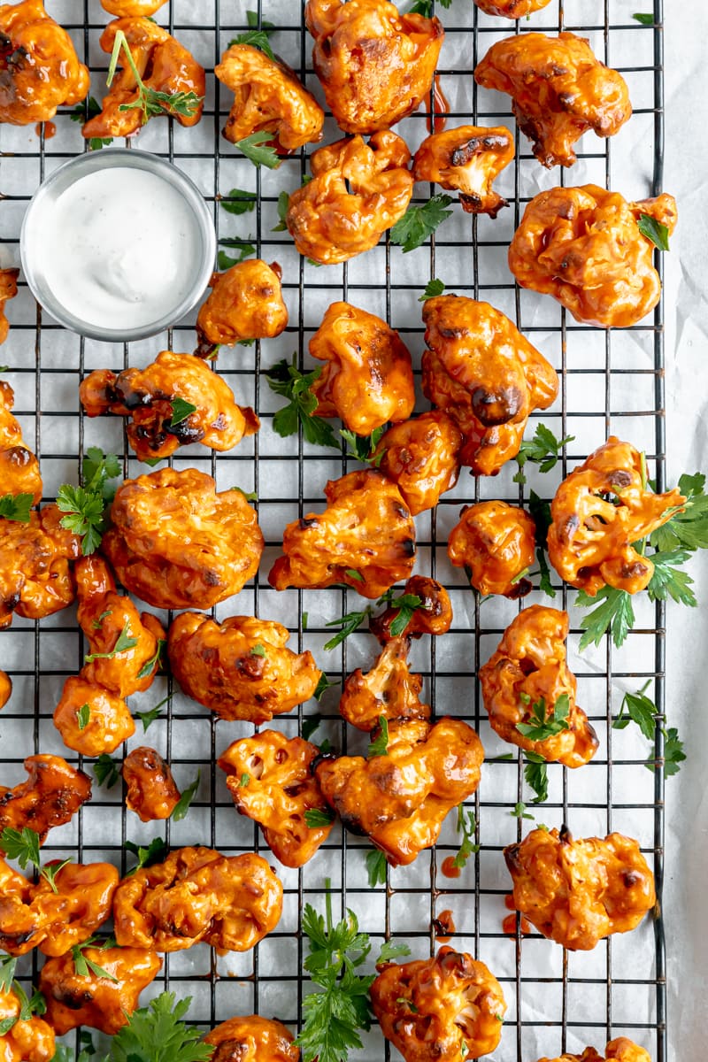 overhead shot of easy buffalo cauliflower wings on a cooling rack