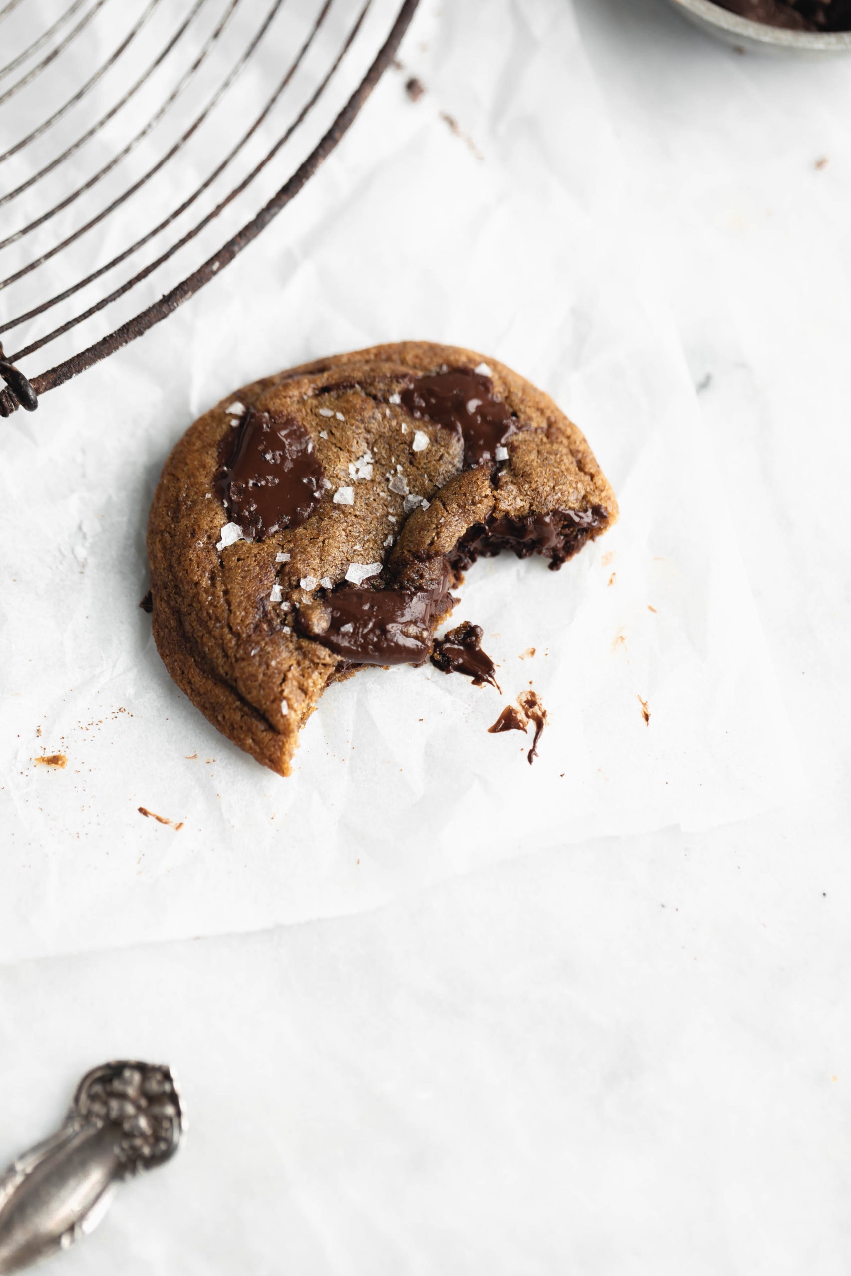 espresso chocolate chip cookie with a bite taken out