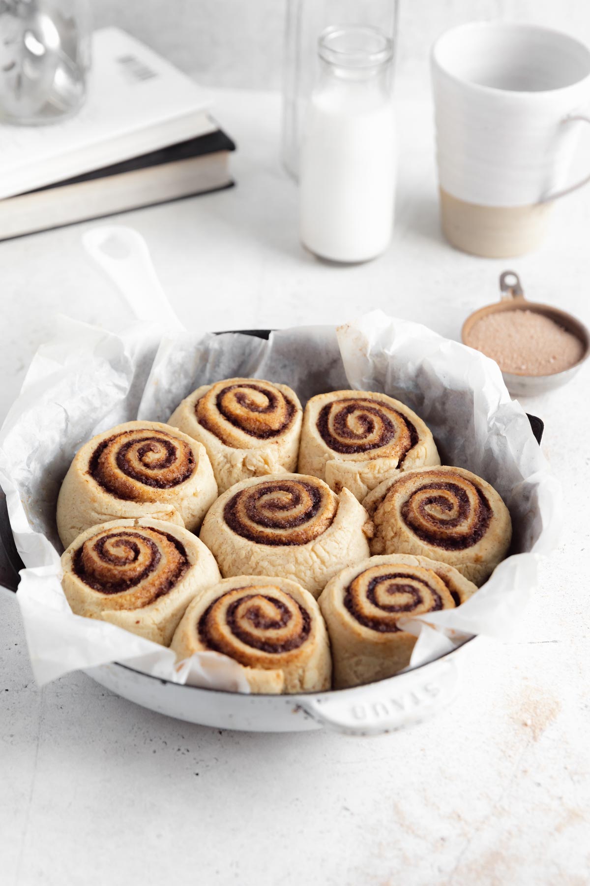 gluten free vegan cinnamon rolls in a round pan
