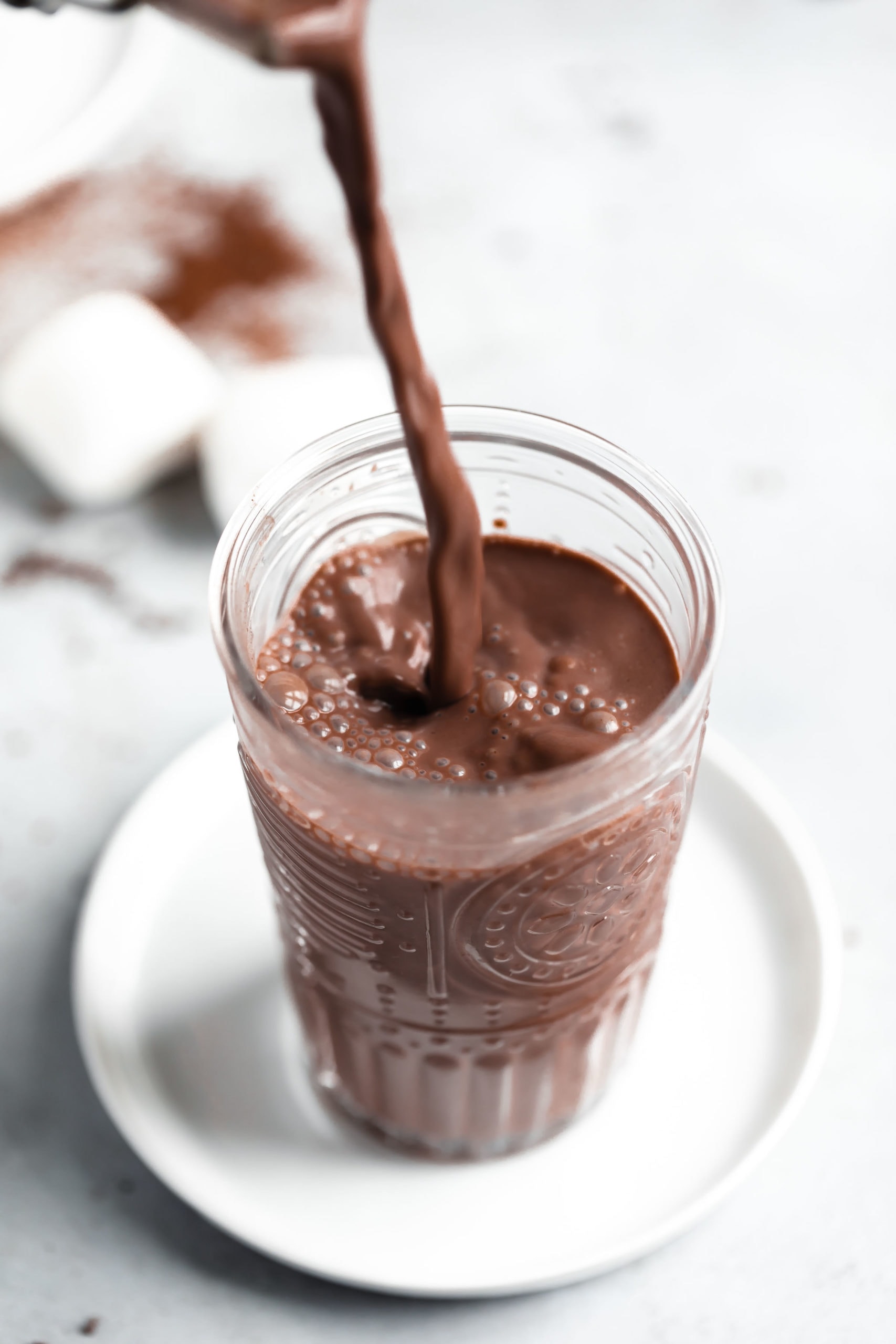 chocolate being poured into glass