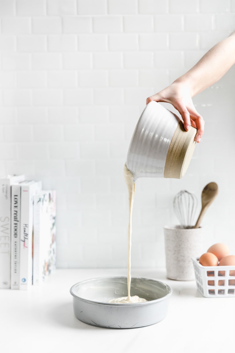 cake batter pouring into pans