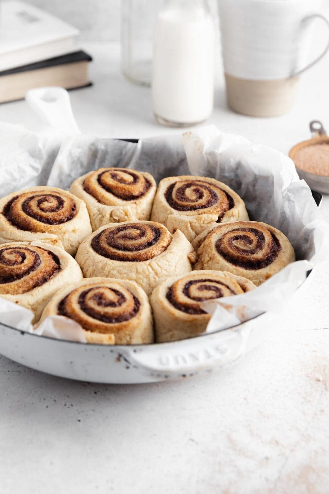 gluten free vegan cinnamon rolls in a round pan