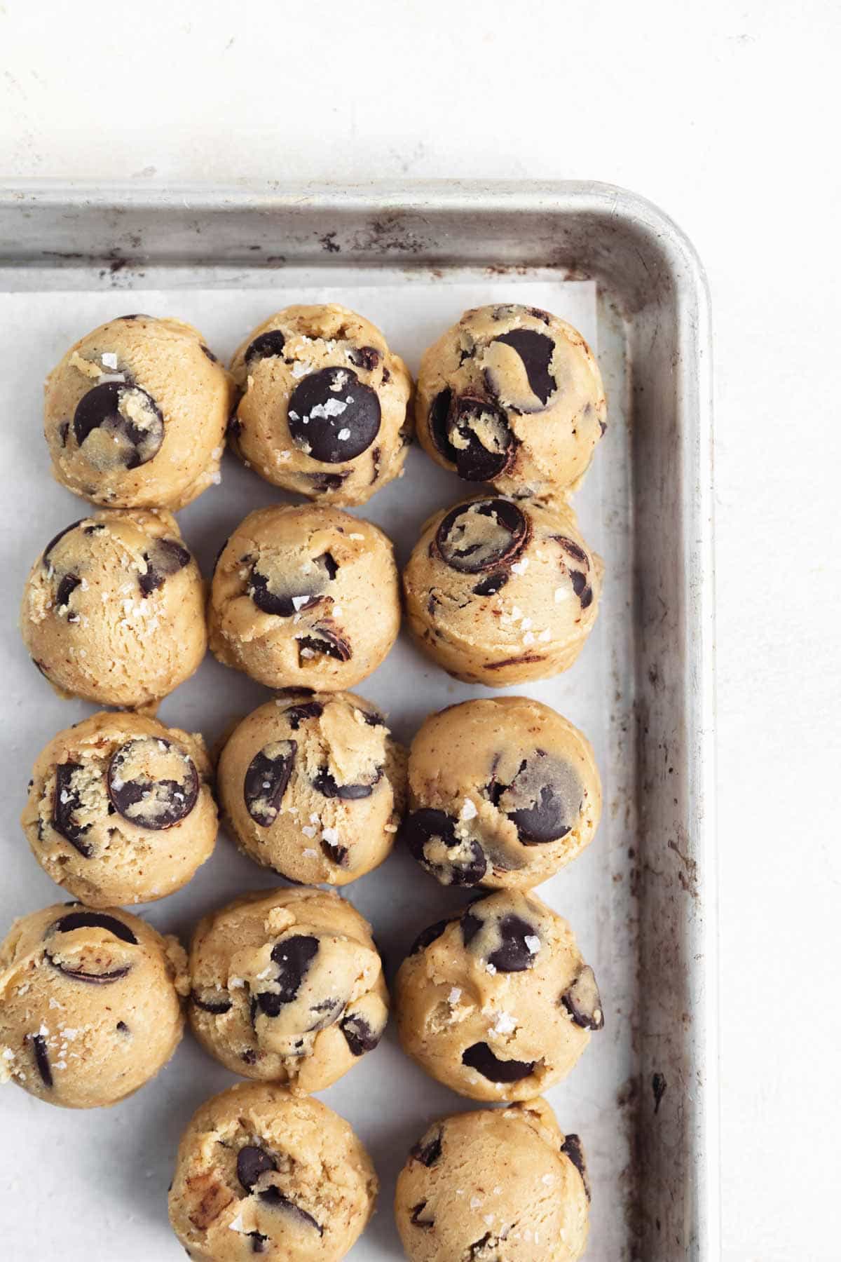 chocolate chip cookie dough on baking sheet