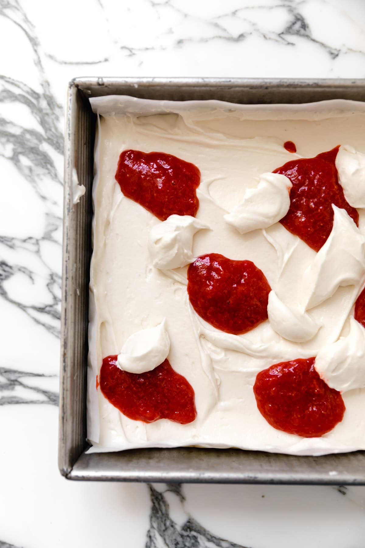 cheesecake bars with strawberry swirl