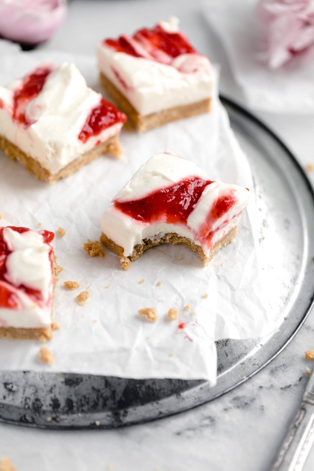 no bake strawberry cheesecake bars with strawberry swirl