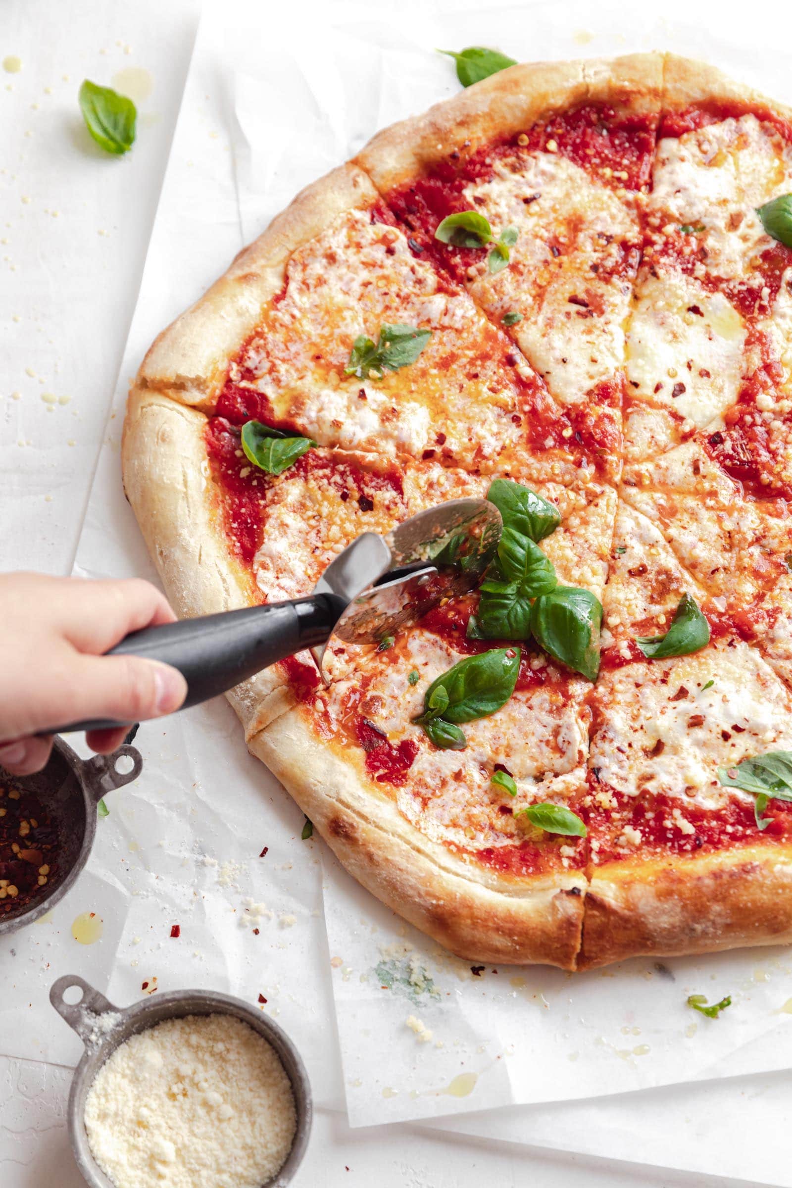 homemade sour dough pizza being cut
