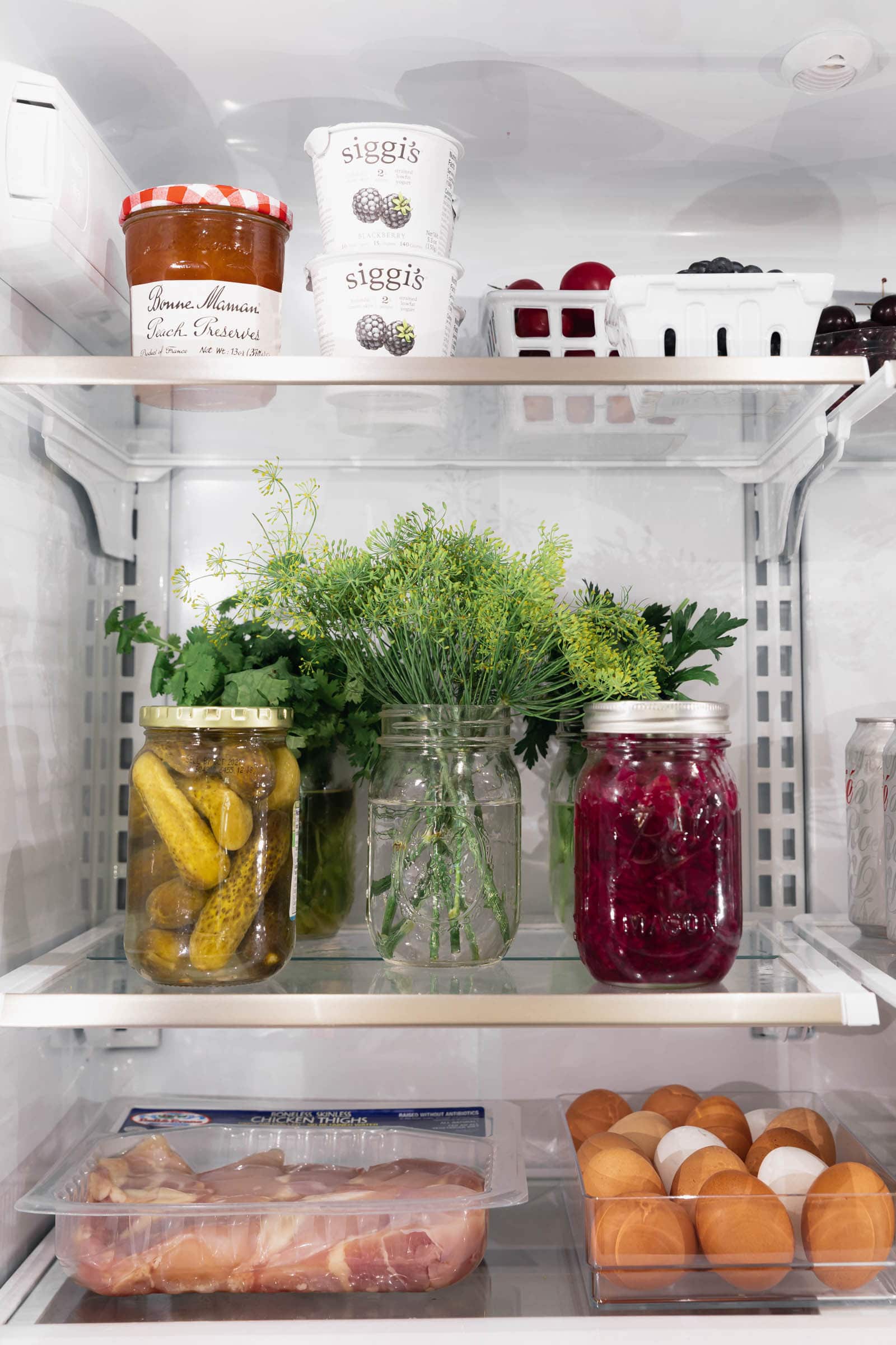 organized fridge with fruits and veggies and meat