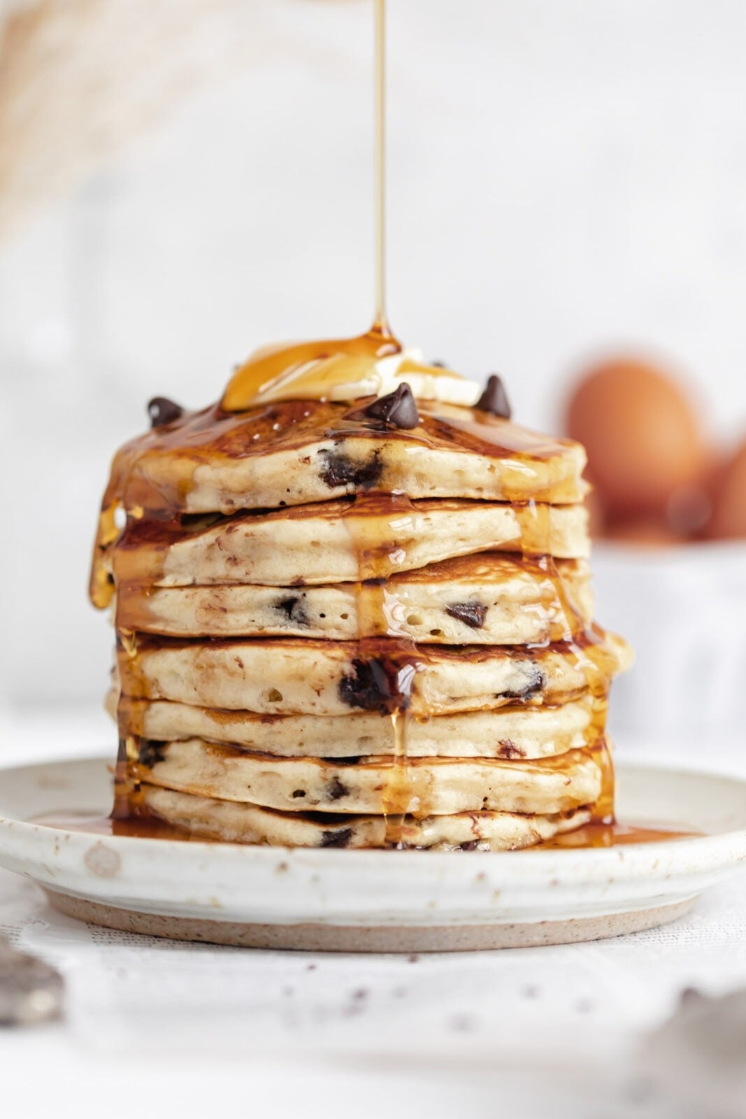 fluffy chocolate chip pancakes with maple syrup