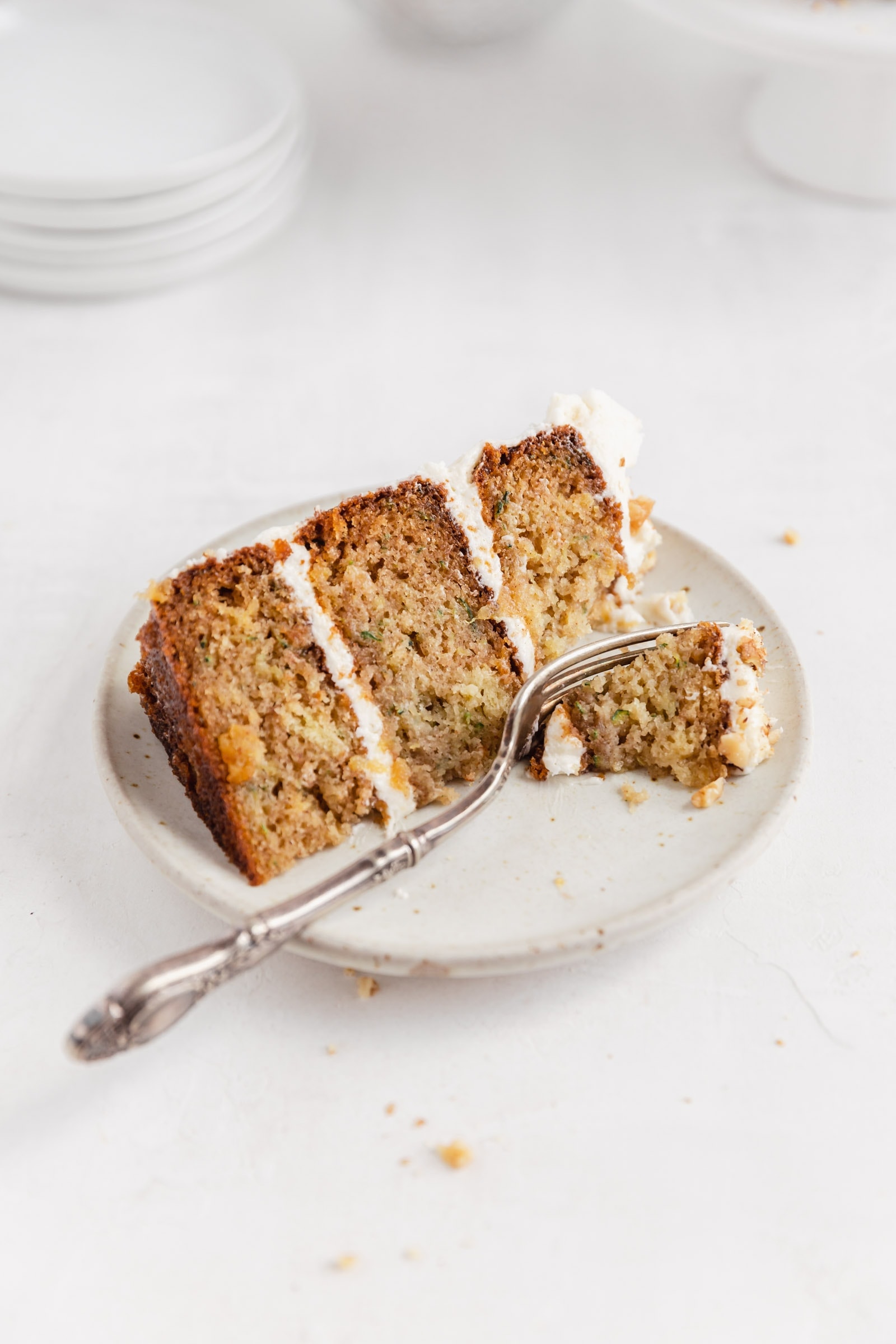 slice of zucchini cake with cream cheese frosting