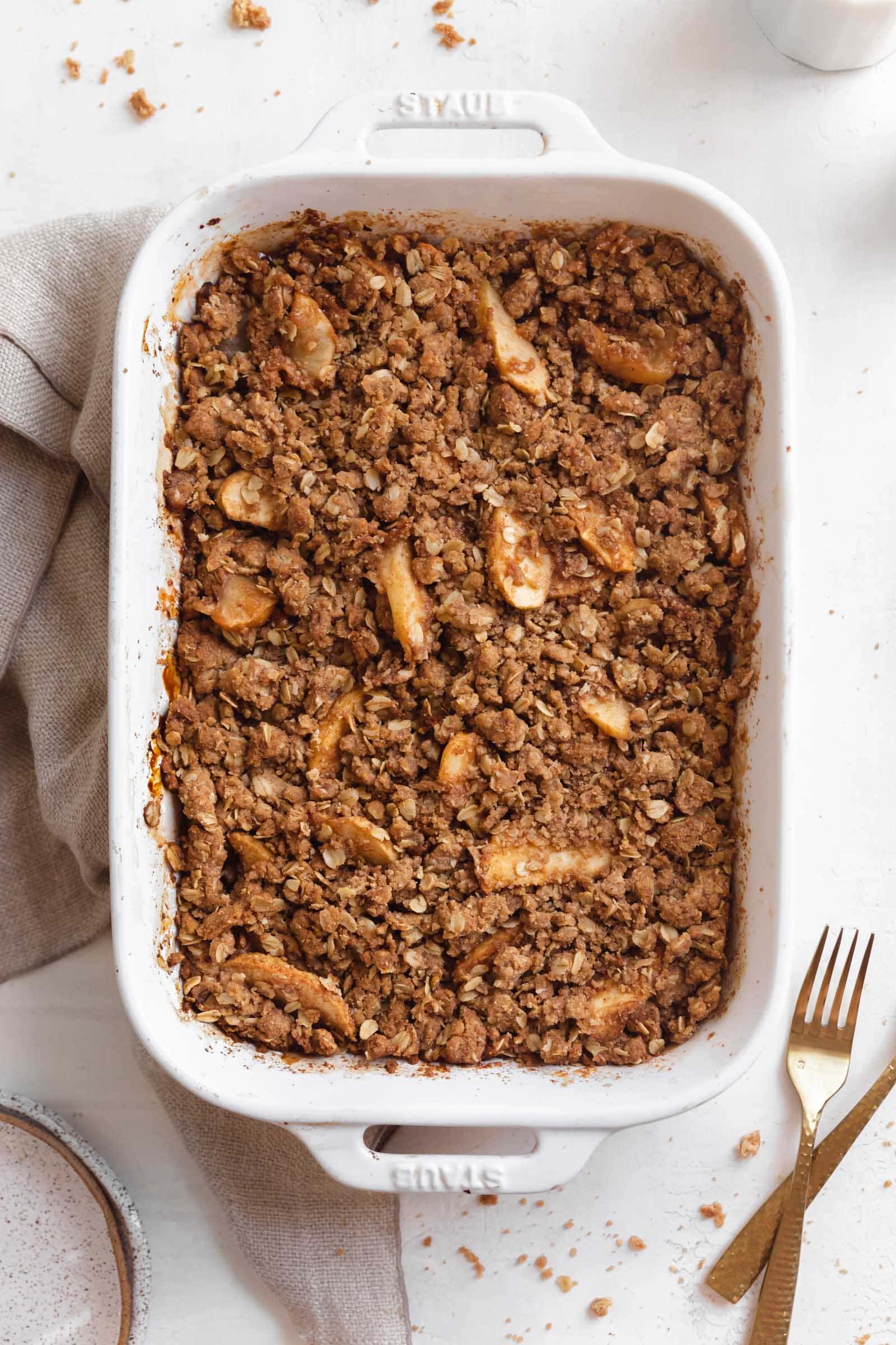 apple crisp in a white baking dish