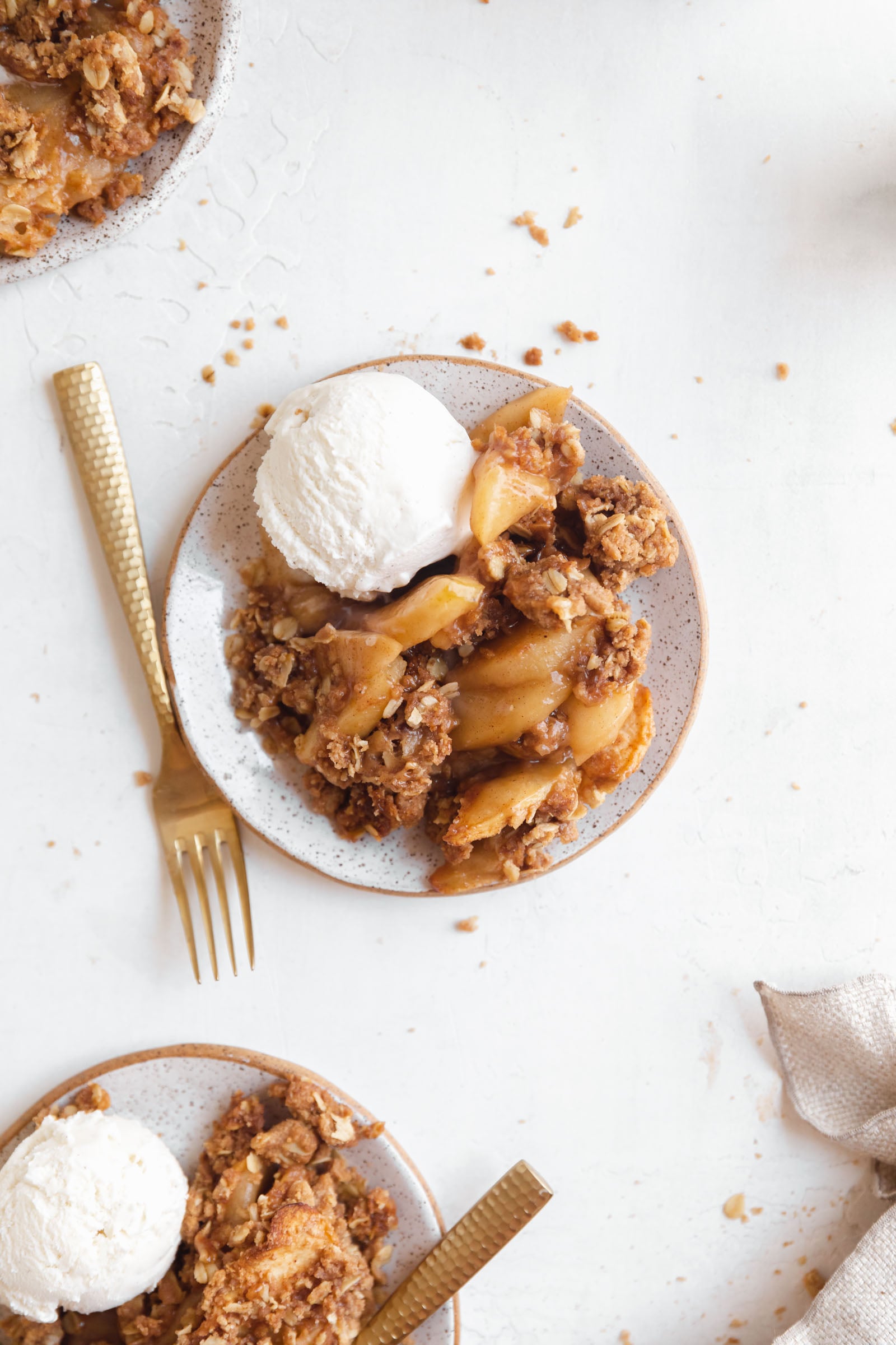 apple crisp with ice cream on a plate