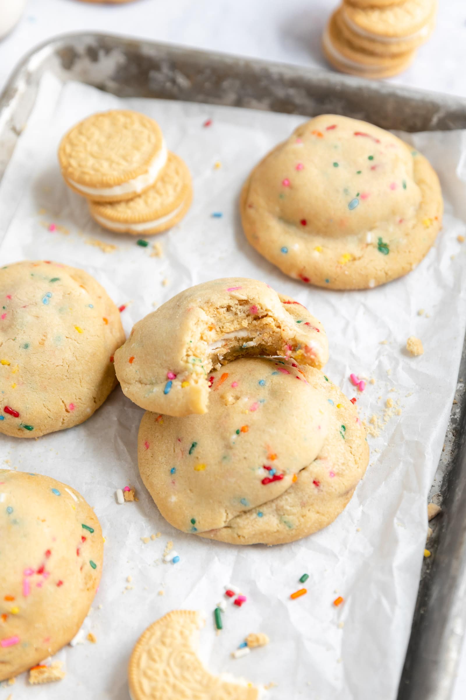 oreo stuffed funfetti cookies on a baking sheet