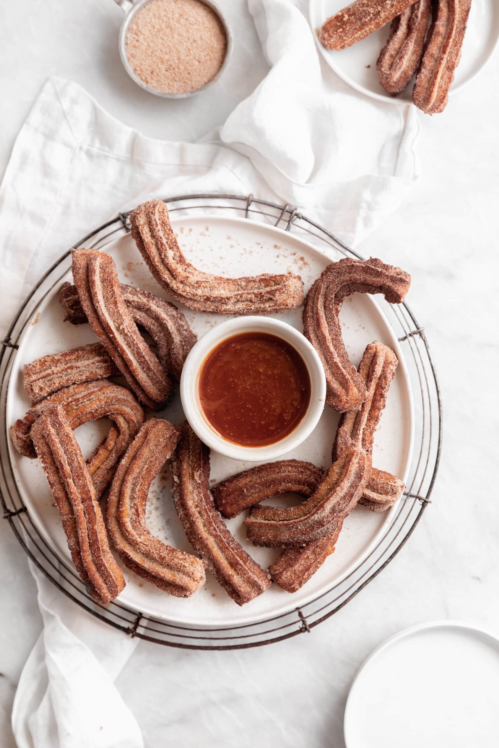 apple cider churros with caramel sauce