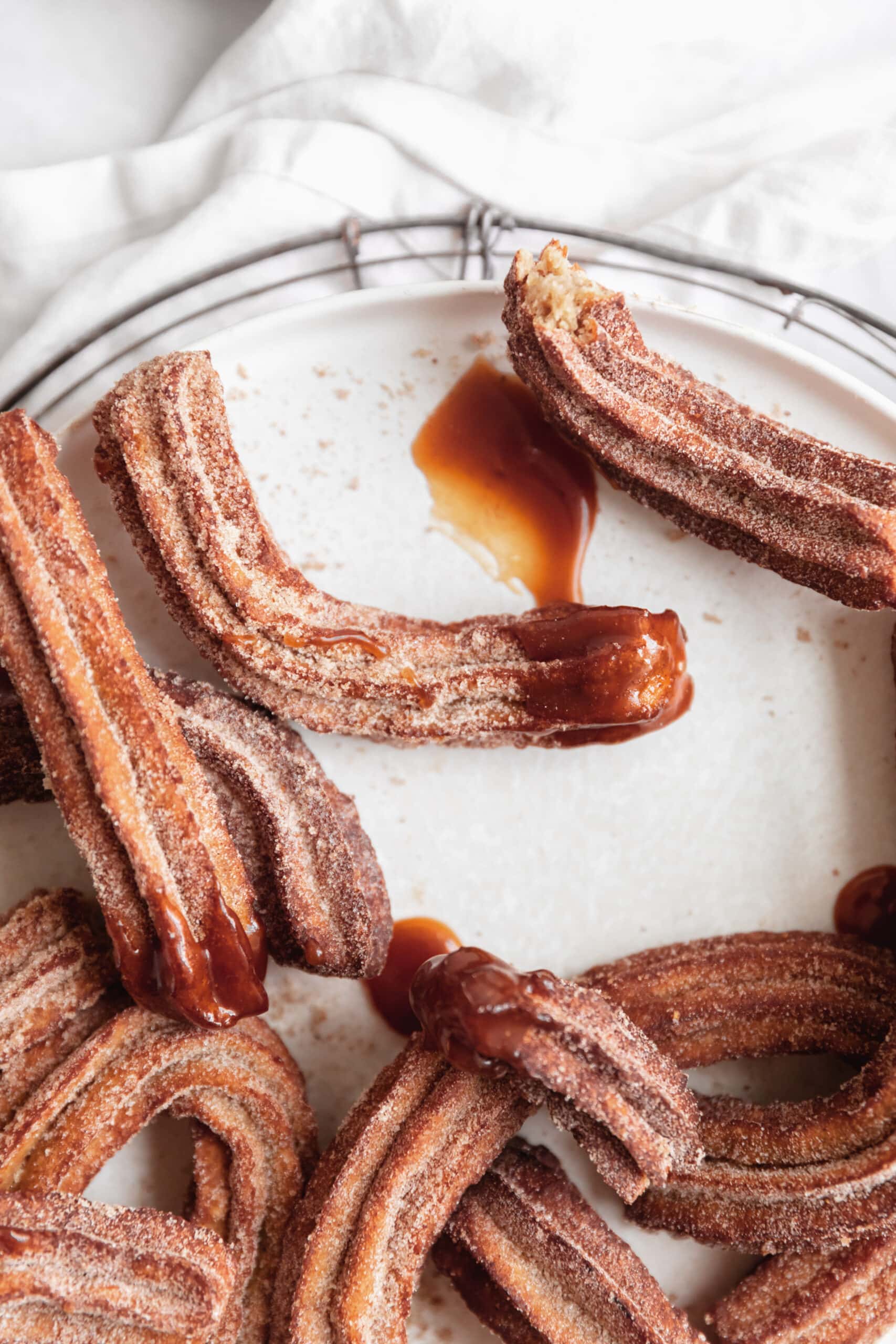 apple cider churros with caramel dipping sauce