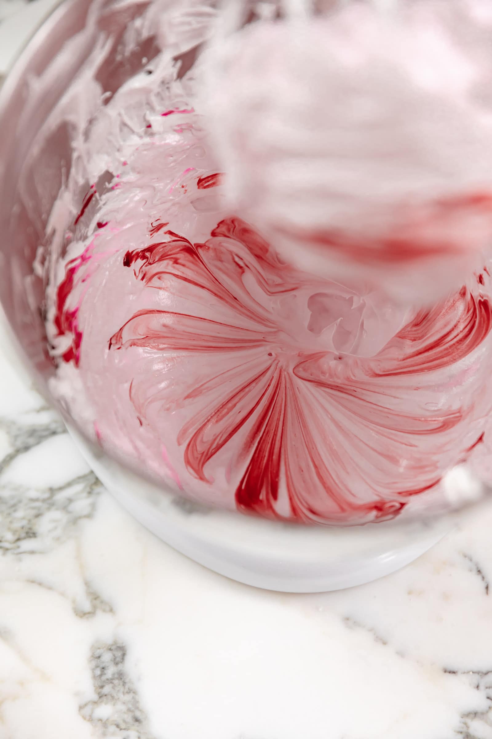 food coloring mixing into macron batter