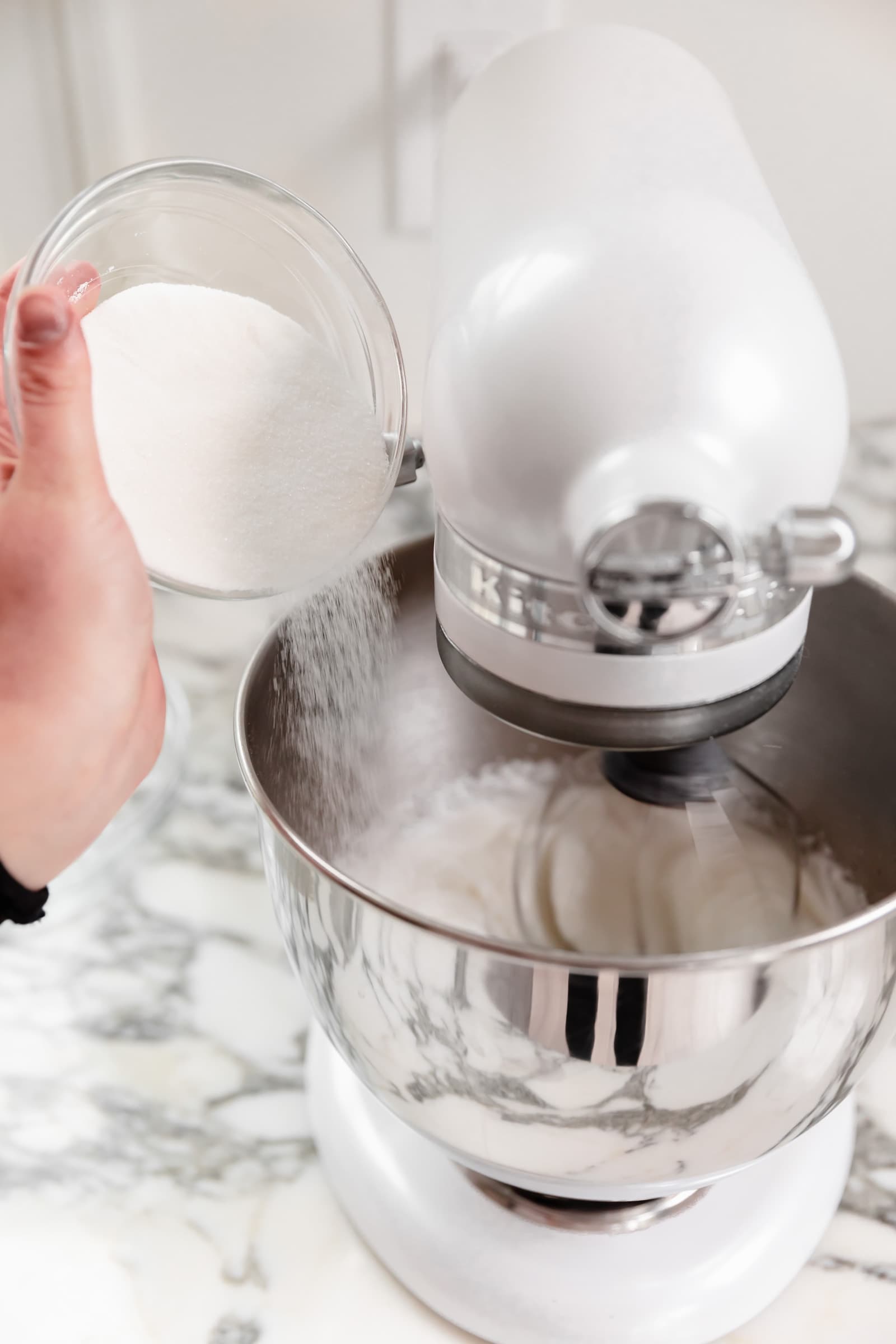 sugar pouring into egg whites