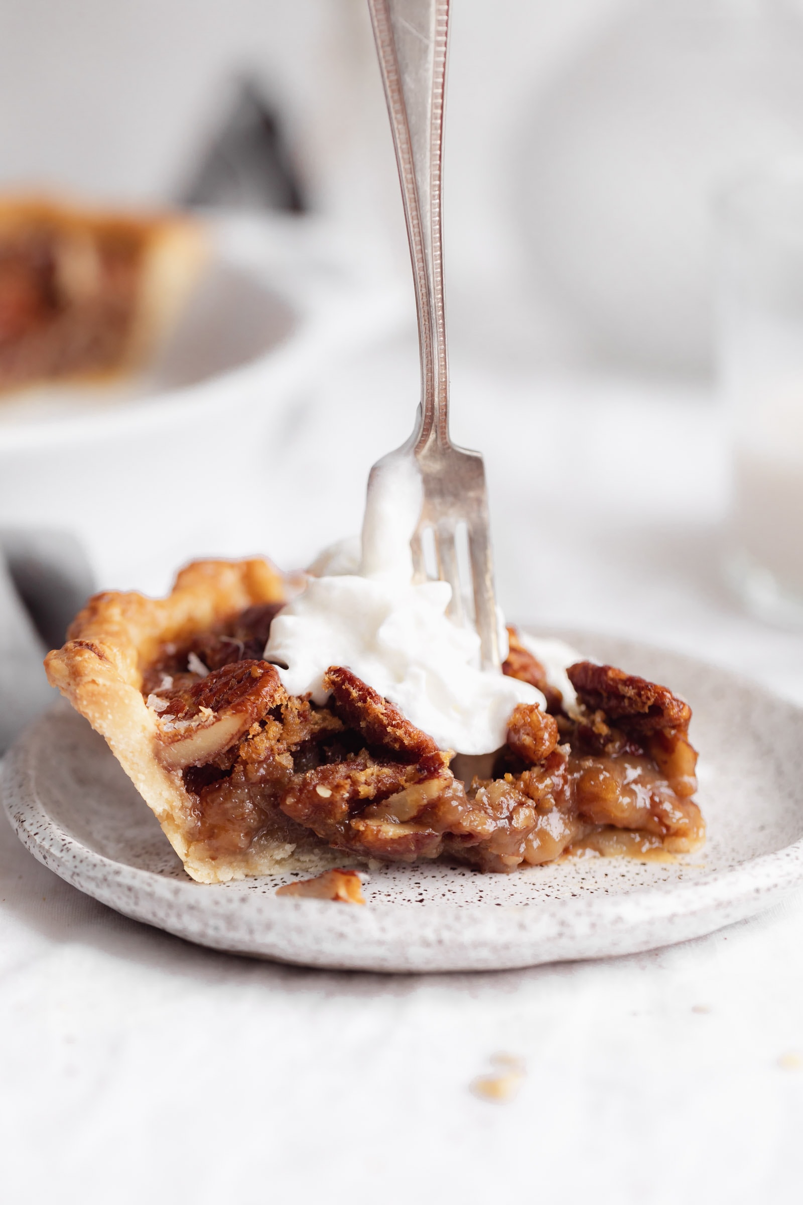 bourbon pecan pie with whipped cream