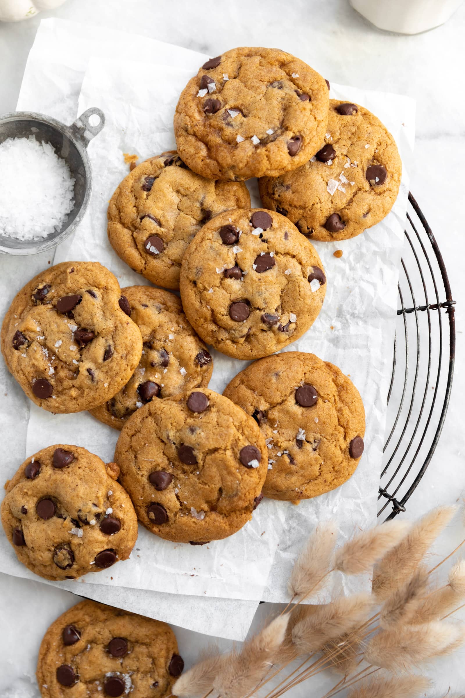 chewy pumpkin chocolate chip cookies on a cooling rack