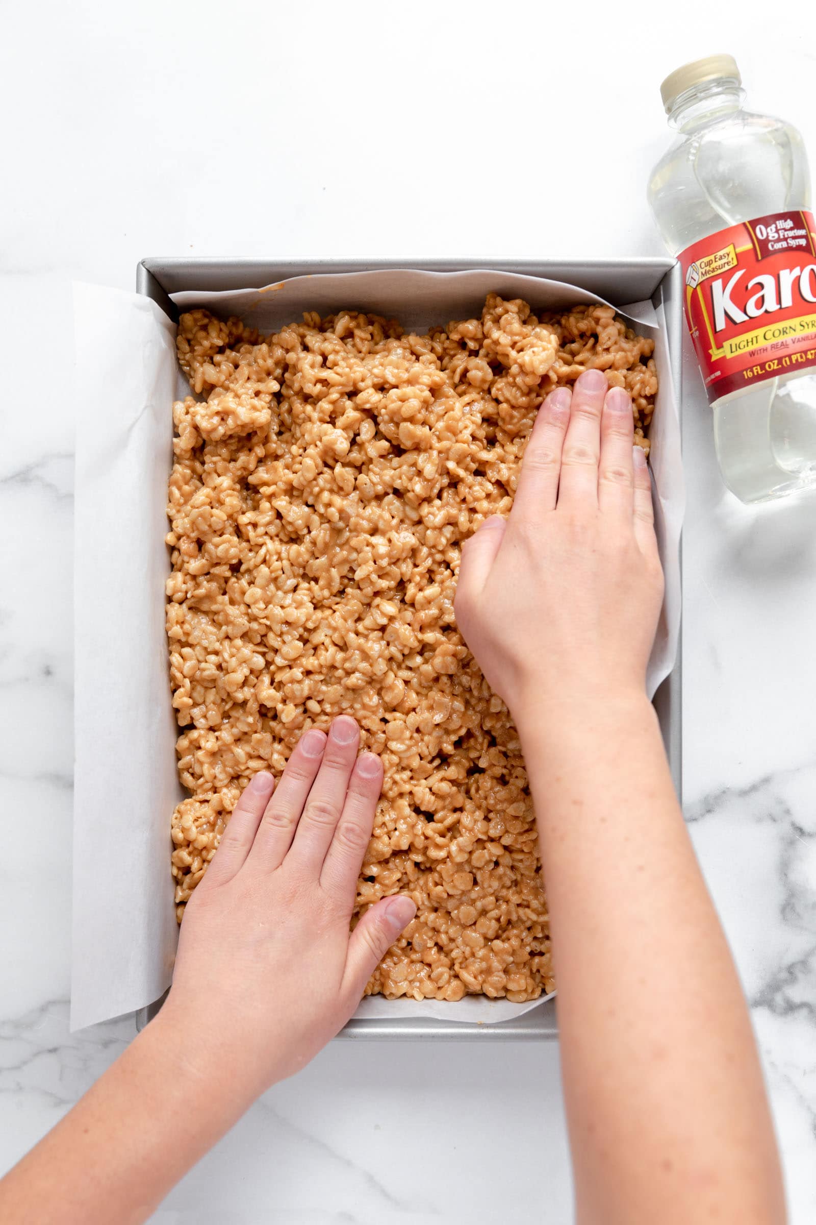 scotcheroos pressing into a pan