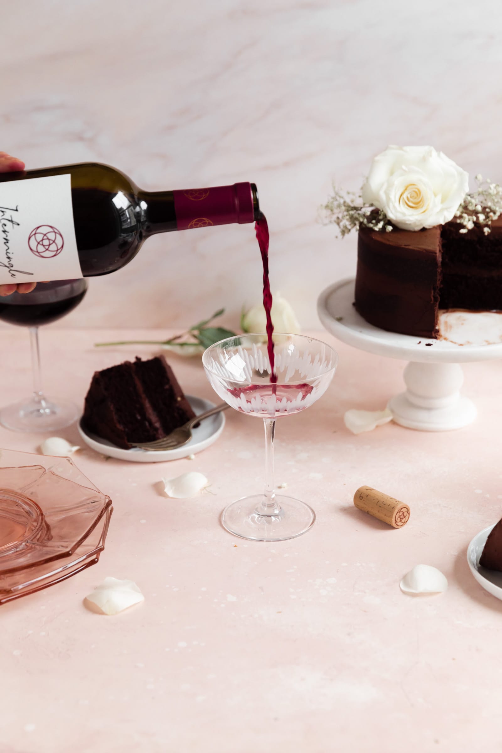 red wine pouring into glass