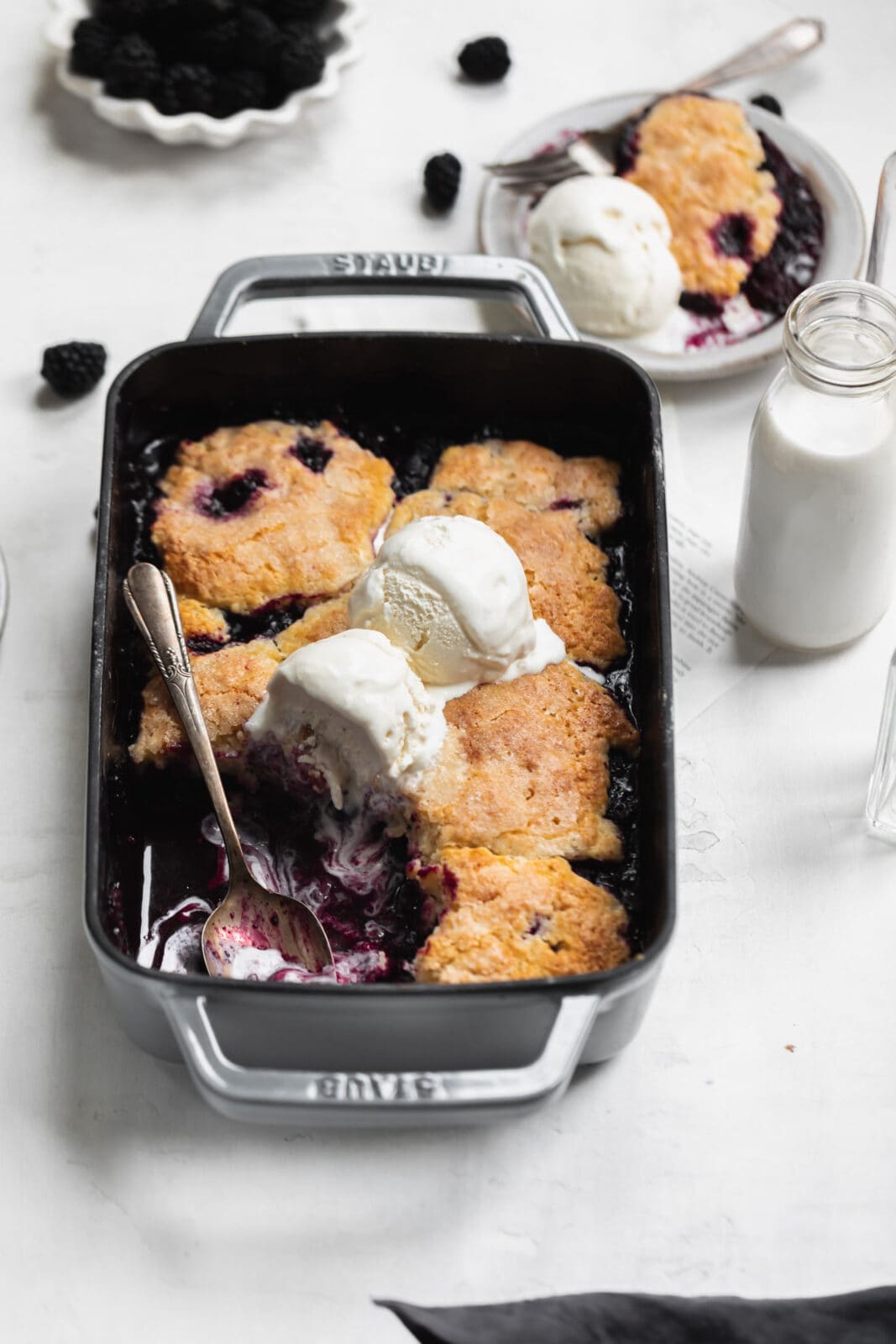 mixed berry cobbler with a spoon