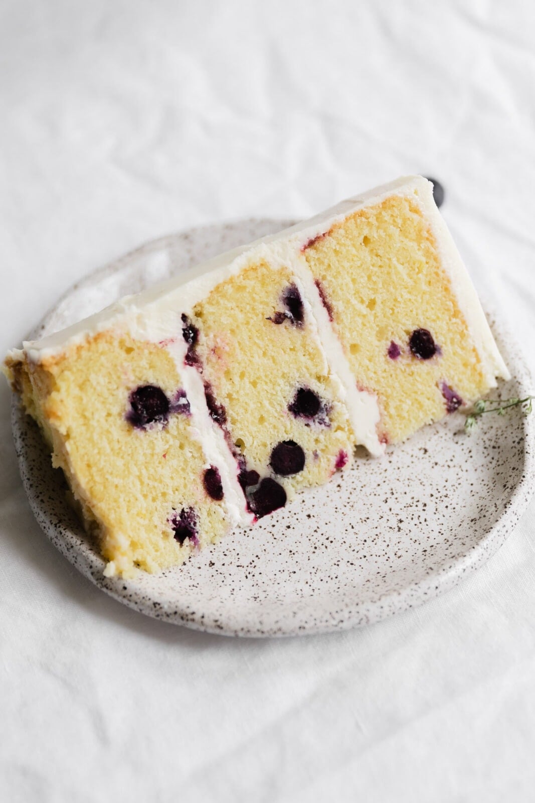 slice of lemon blueberry cake on a plate