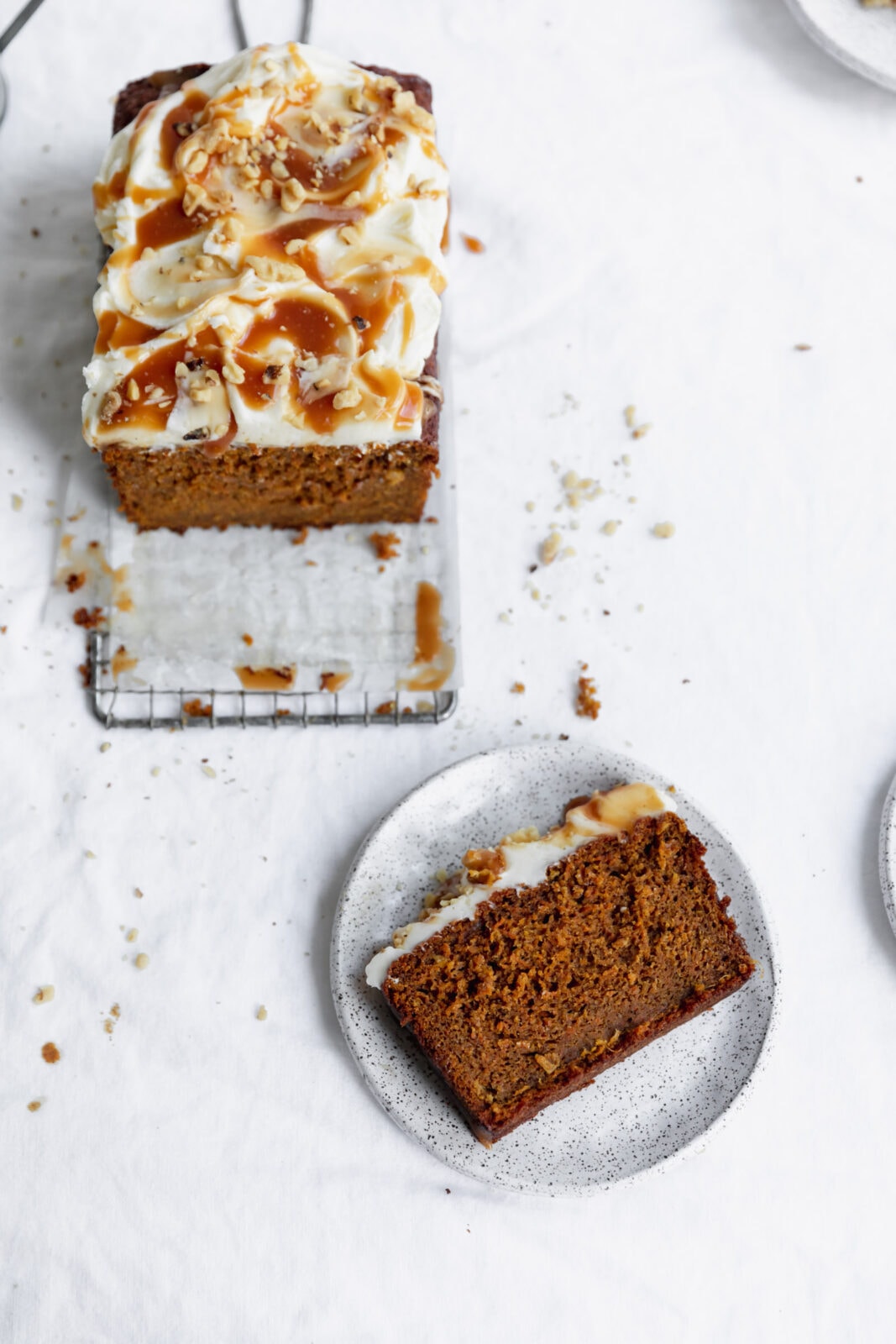 whole wheat carrot cake loaf on a bread board