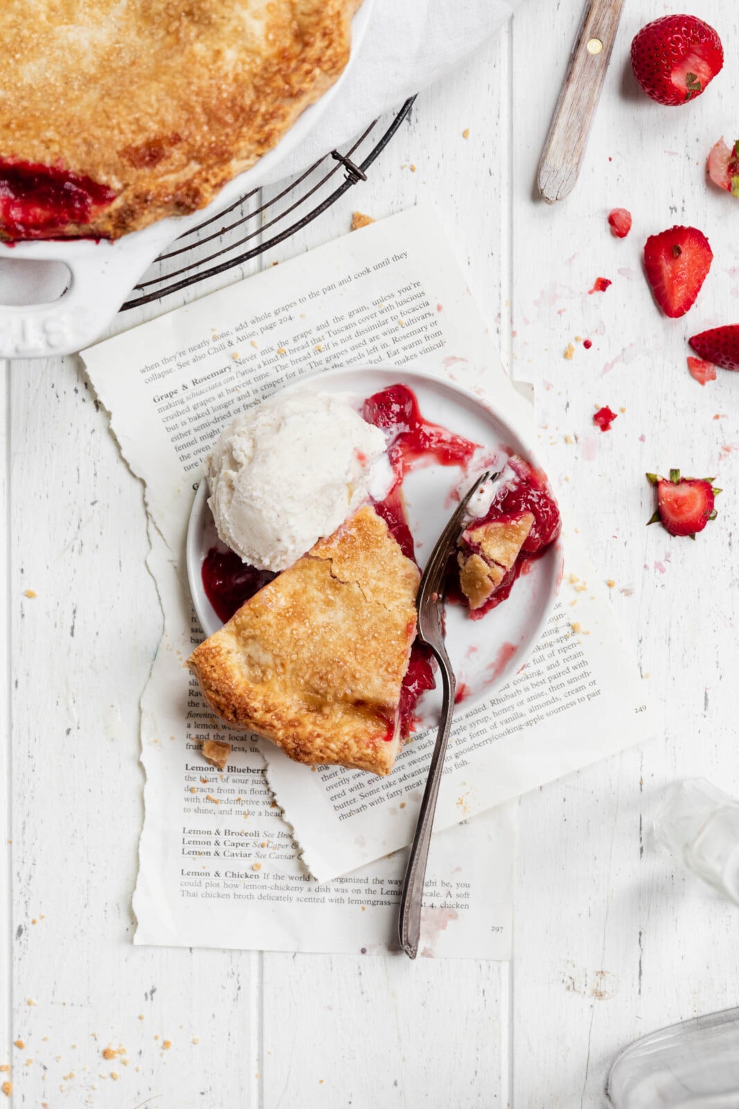 slice of strawberry rhubarb pie with ice cream