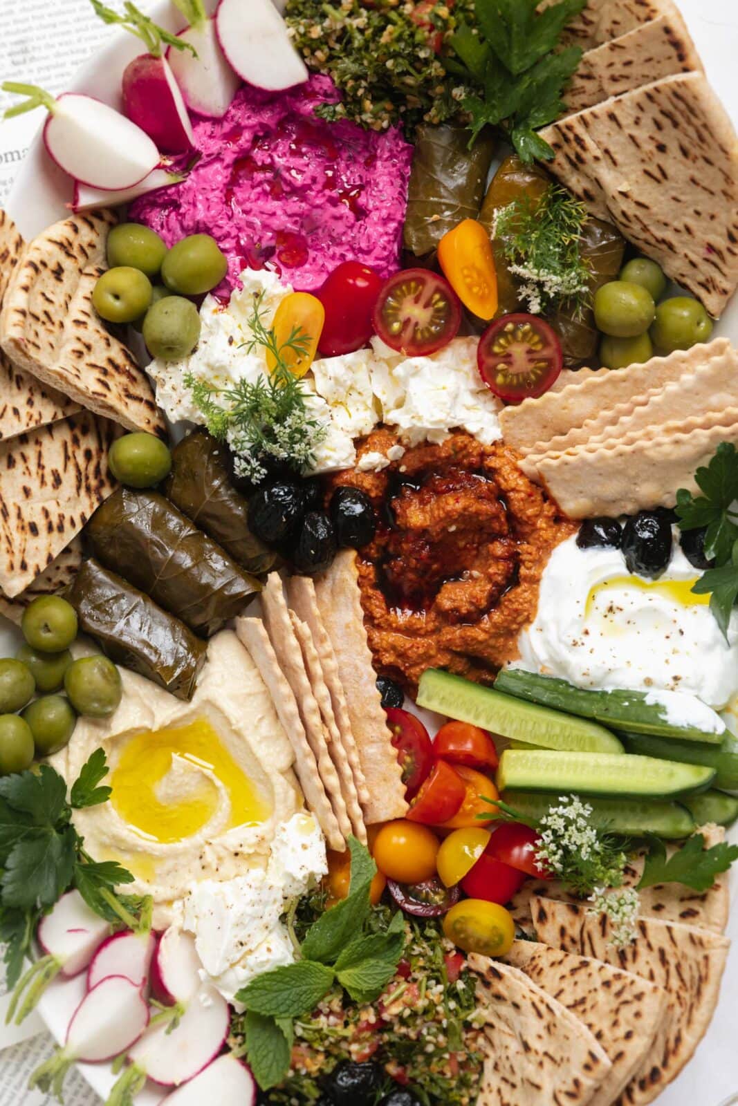 mezze board with spreads, hummus, pita, and veggies