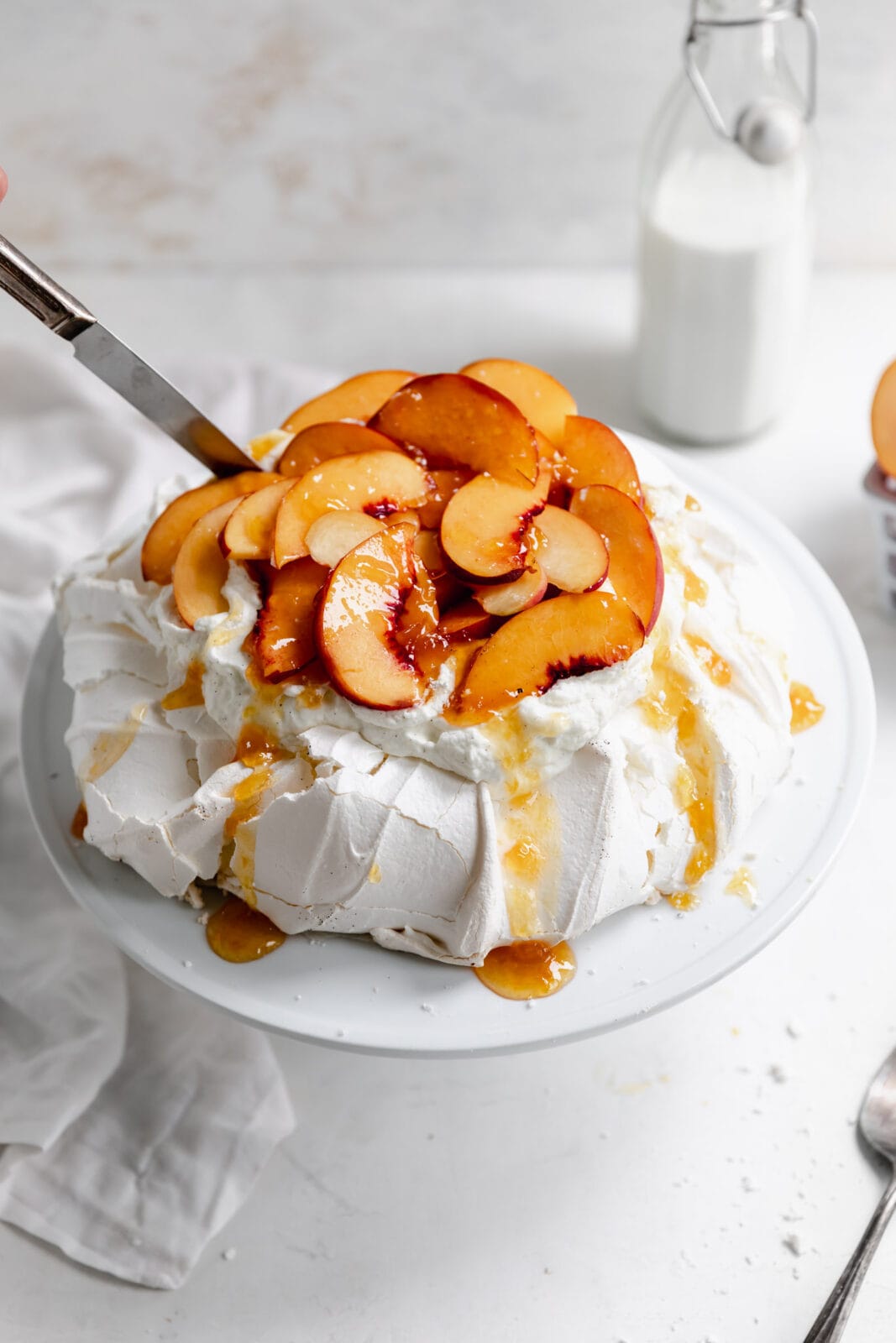 peaches and cream pavlova with peach jam