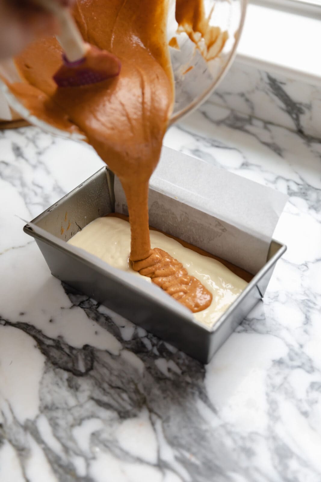 pumpkin batter and cheesecake batter swirl