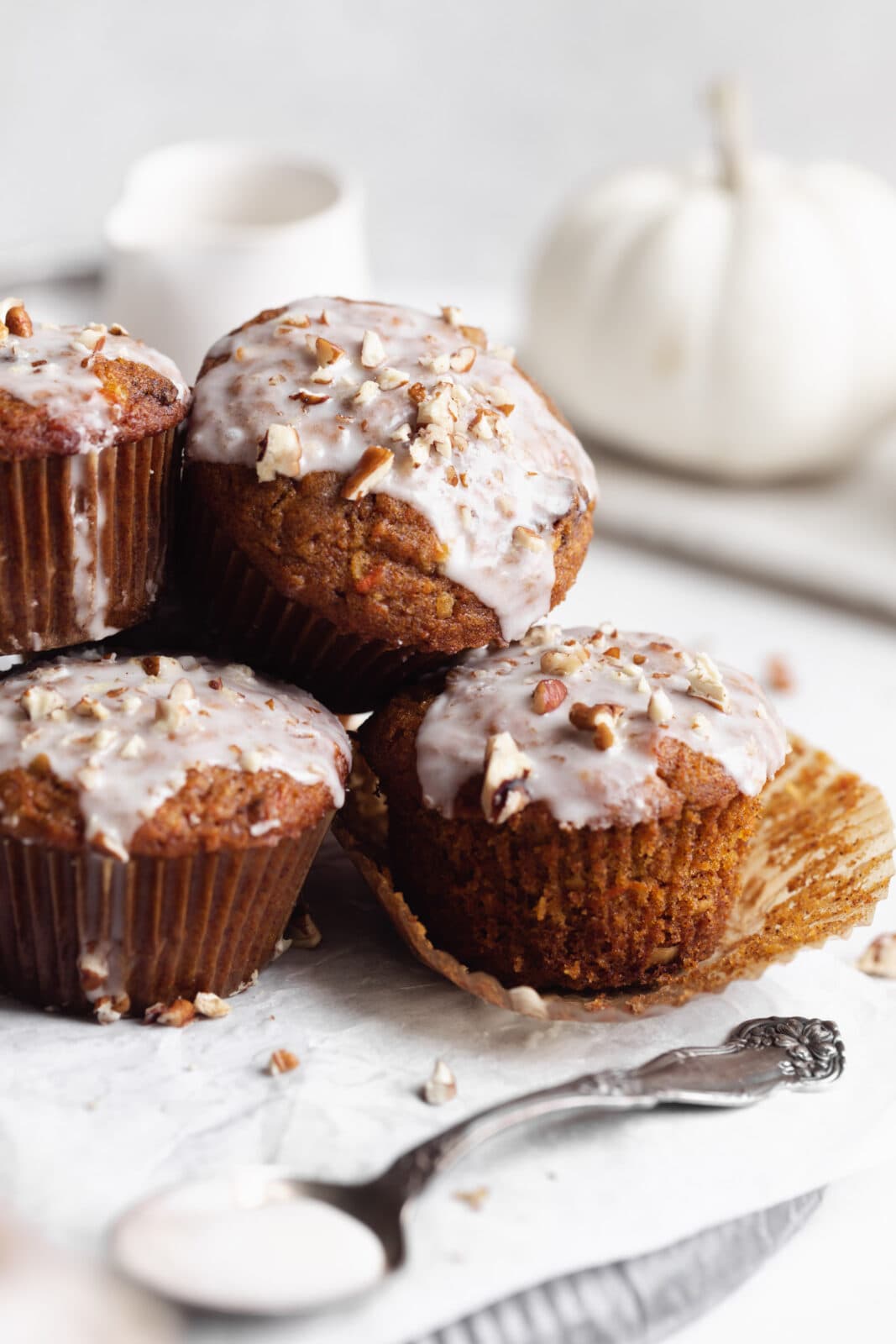 pumpkin carrot cake muffins in a stack