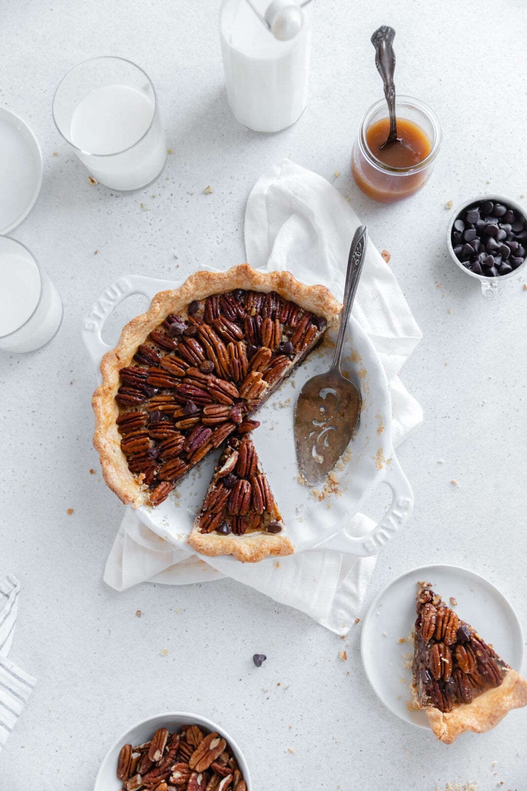 turtle pecan pie with slices taken out