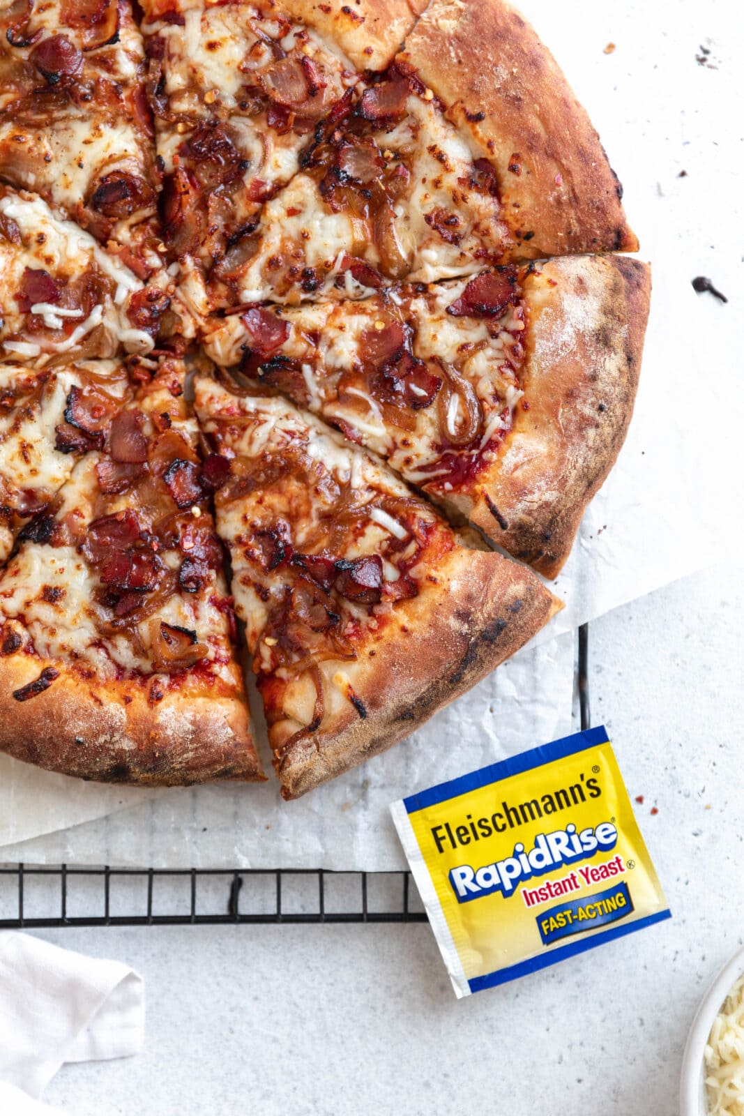 barbecue bacon pizza cut into slices