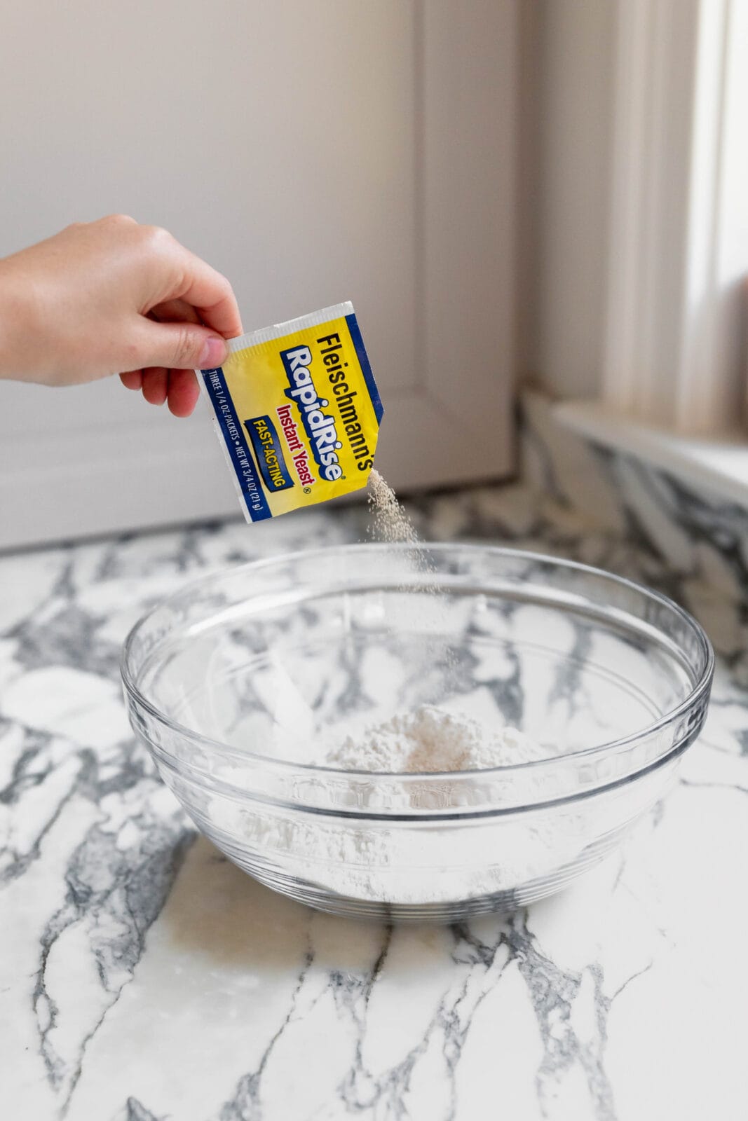 yeast pouring into bowl