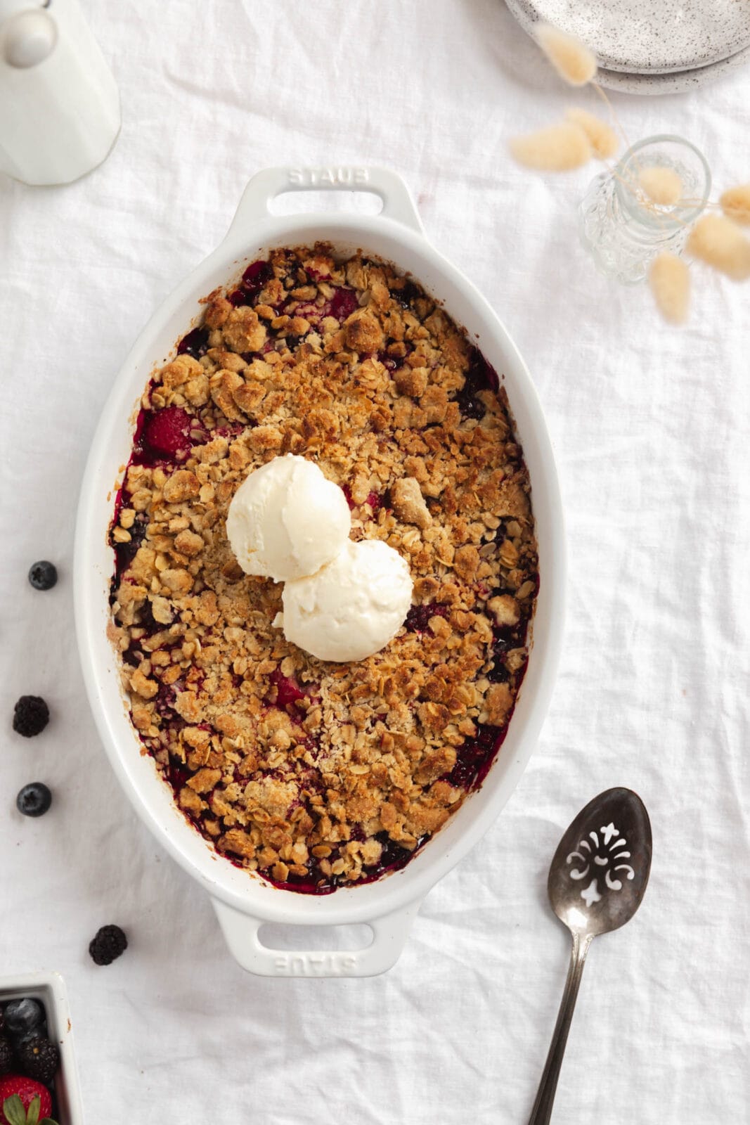 mixed berry crisp with vanilla ice cream