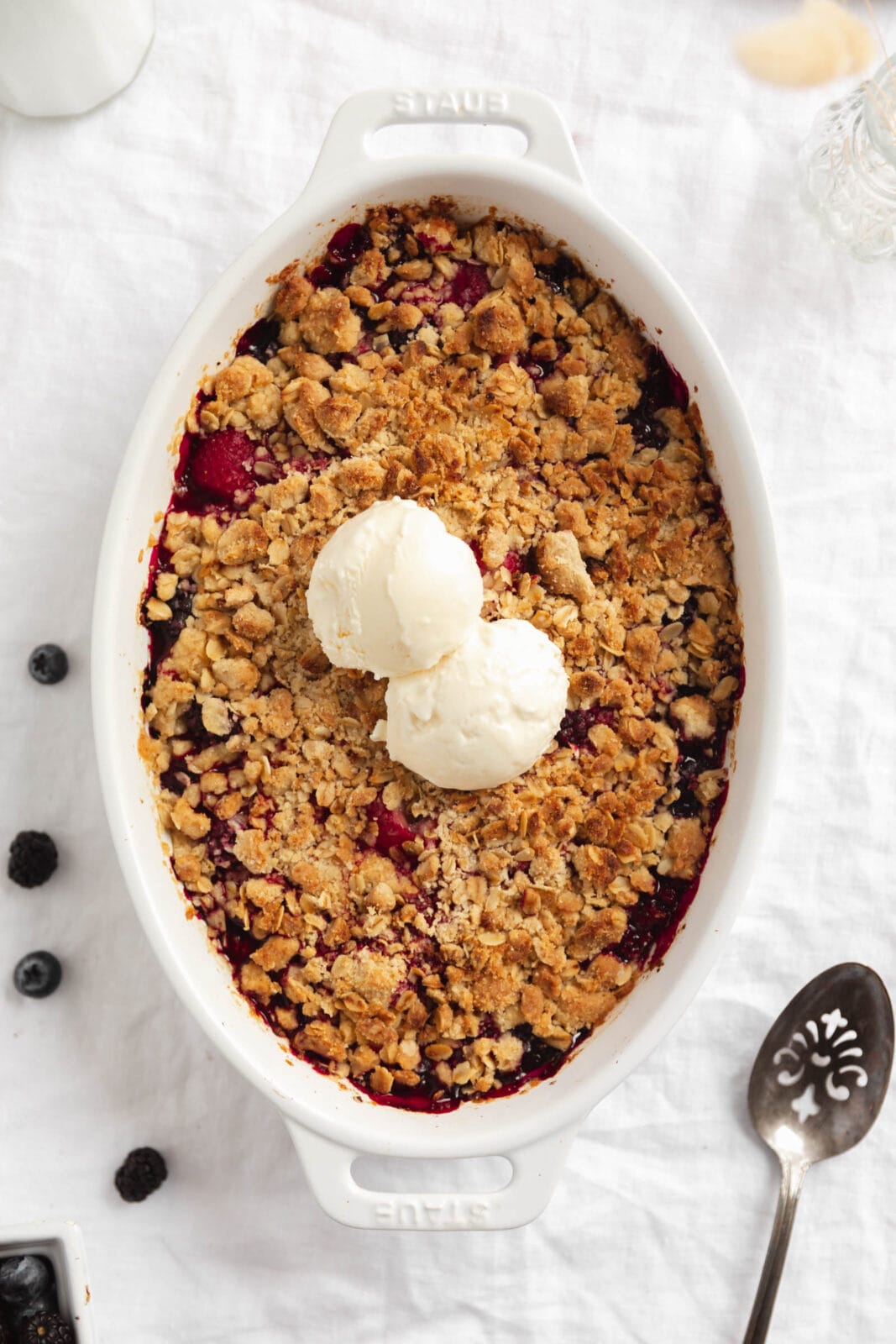 mixed berry crisp with vanilla ice cream