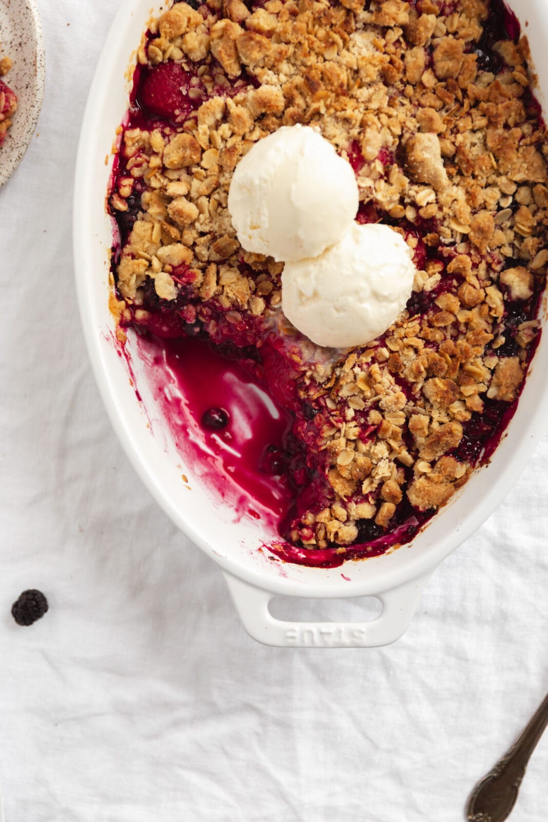 mixed berry crisp with strawberries, blueberries, raspberries, and blackberriess 