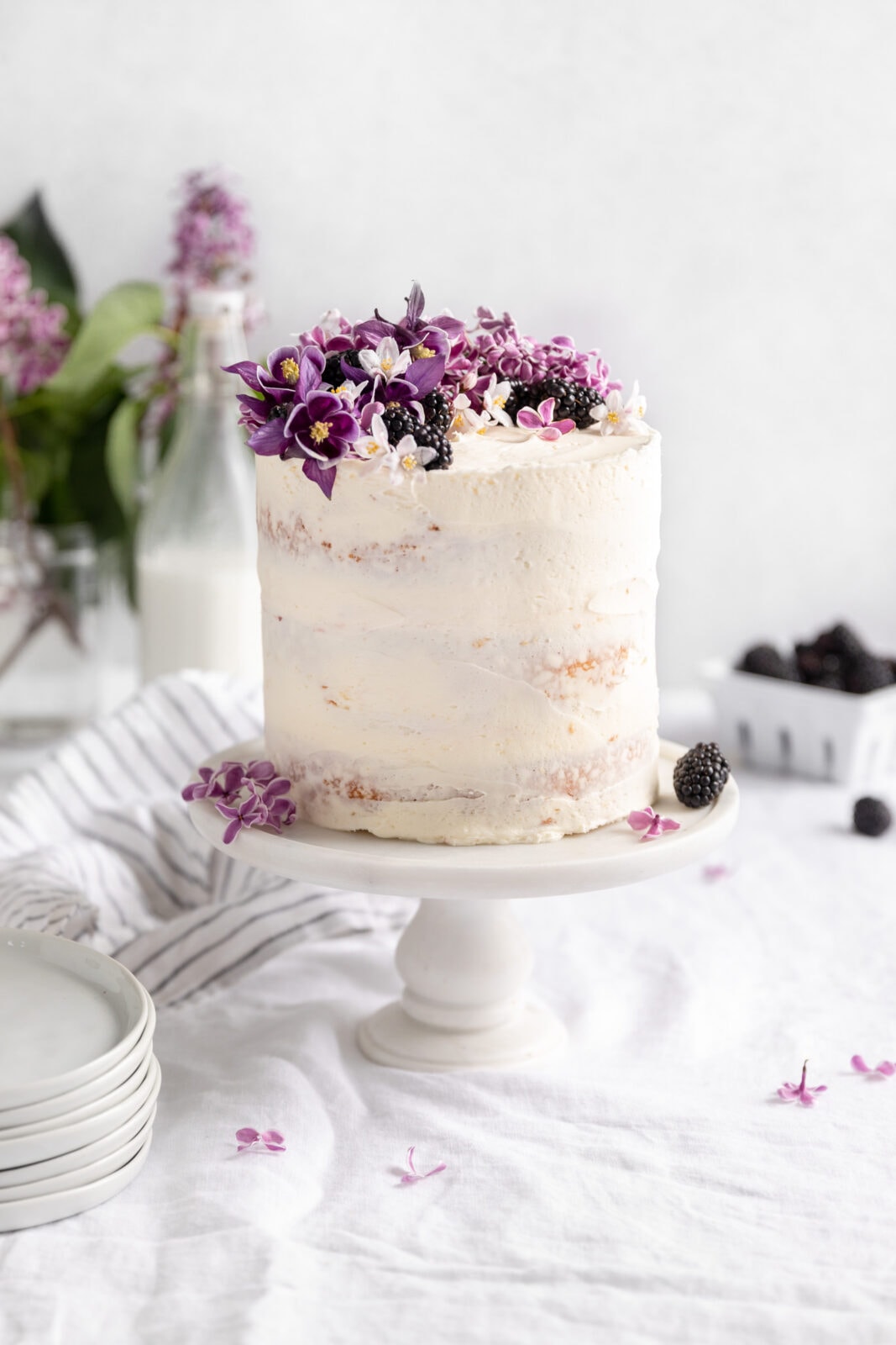 blackberry cake on a cake stand