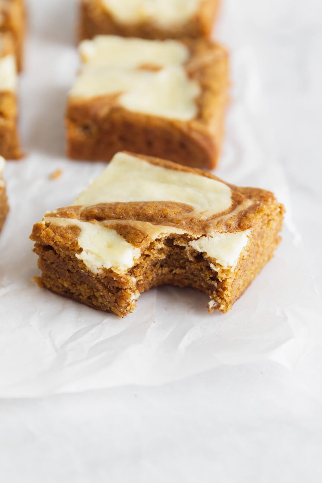 cream cheese swirled pumpkin bars