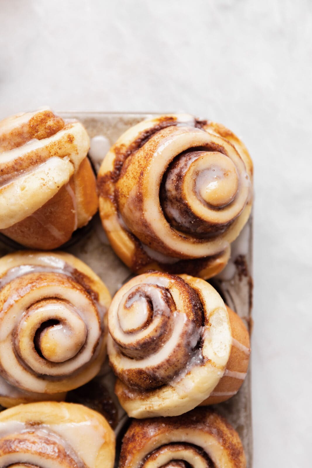 cinnamon roll muffins in a pan