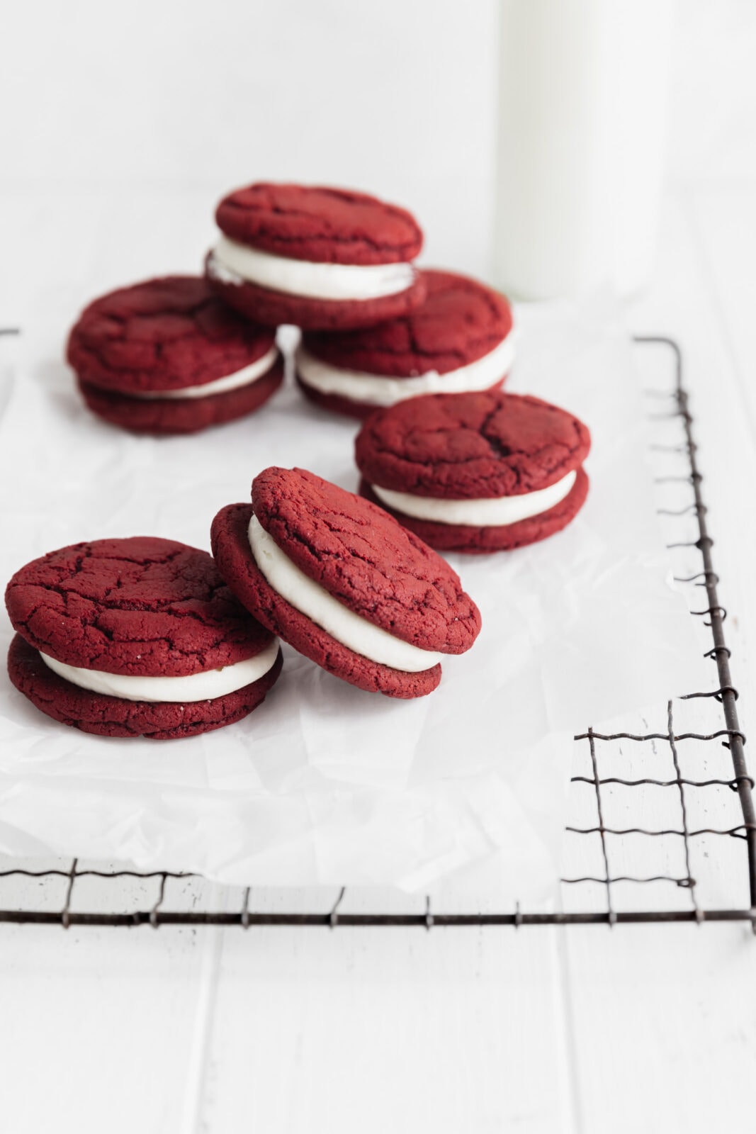 red velvet sandwich cookies with white chocolate frosting